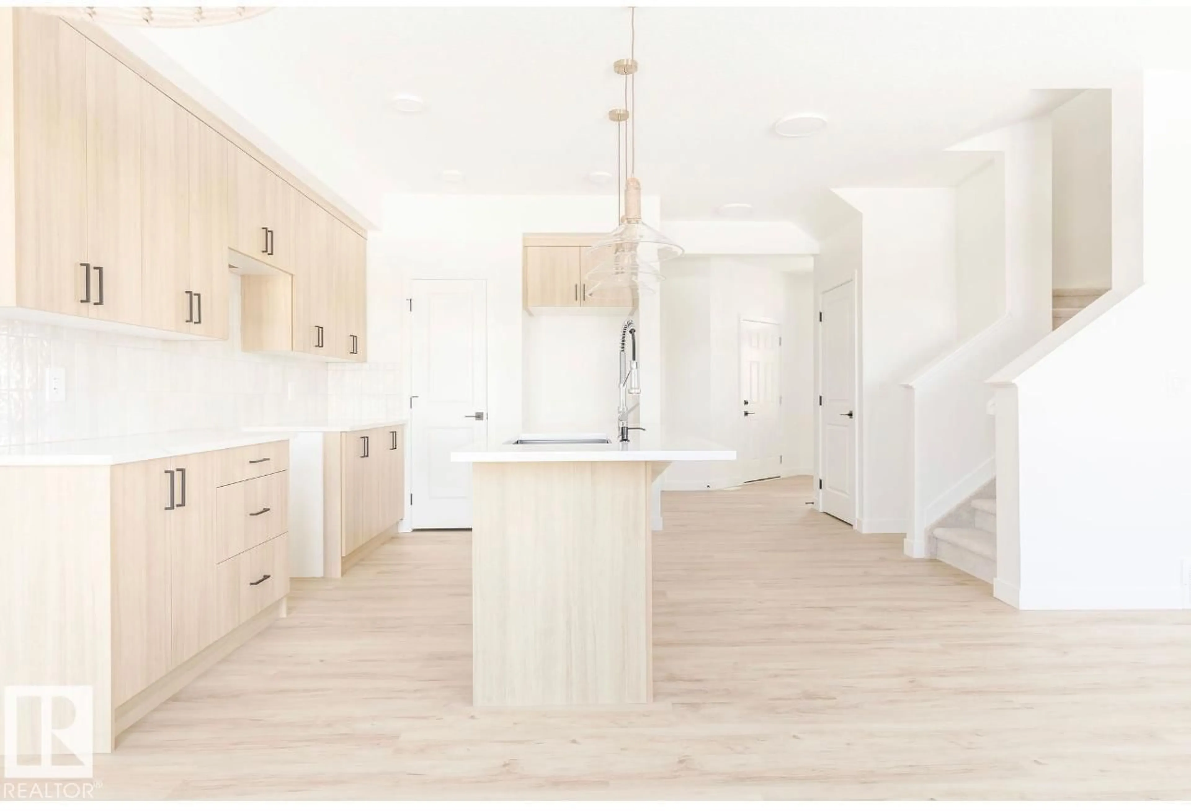 Open concept kitchen, wood/laminate floor for 2634 62 ST, Edmonton Alberta X0X0X0