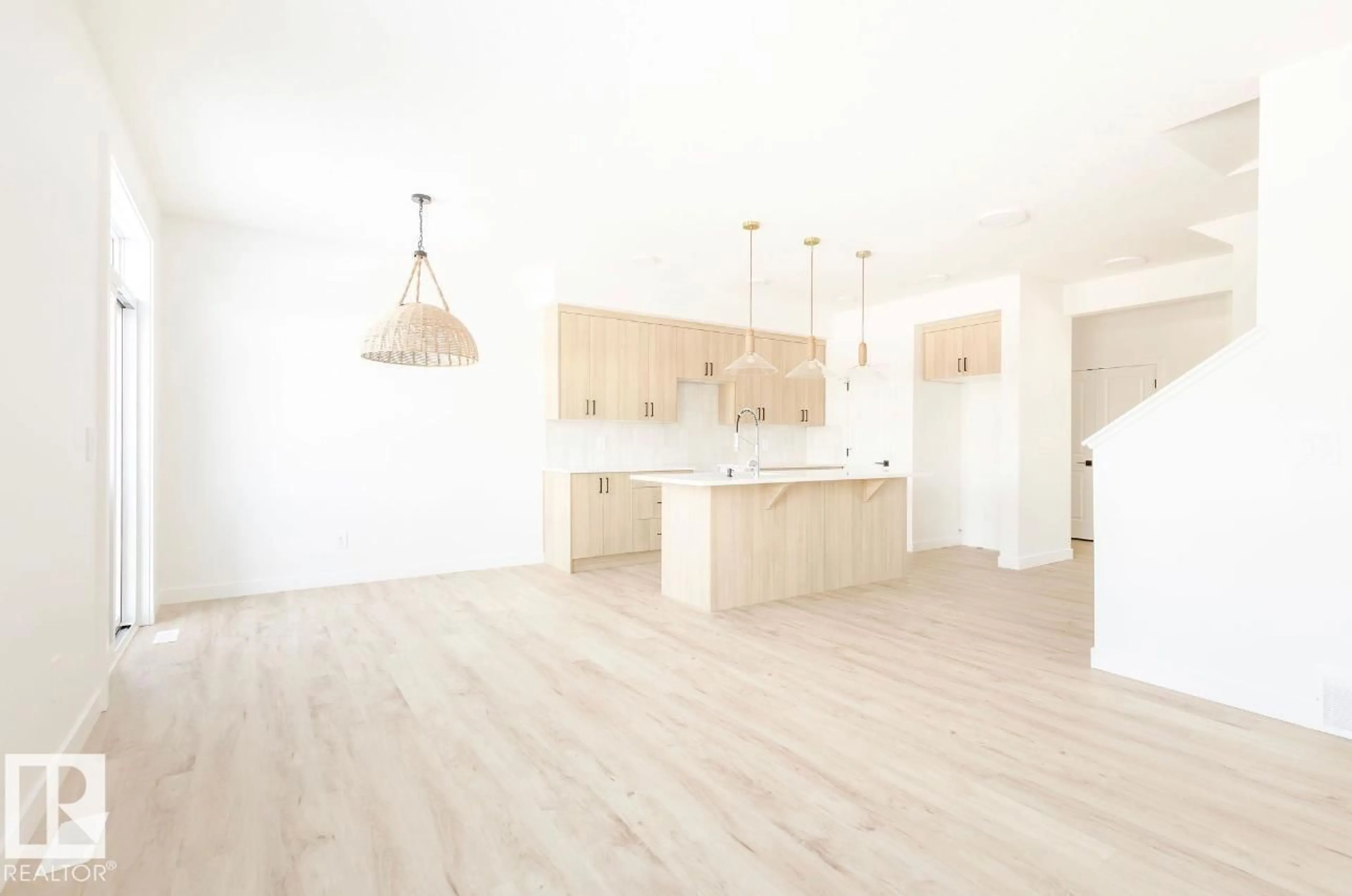 Open concept kitchen, wood/laminate floor for 2634 62 ST, Edmonton Alberta X0X0X0