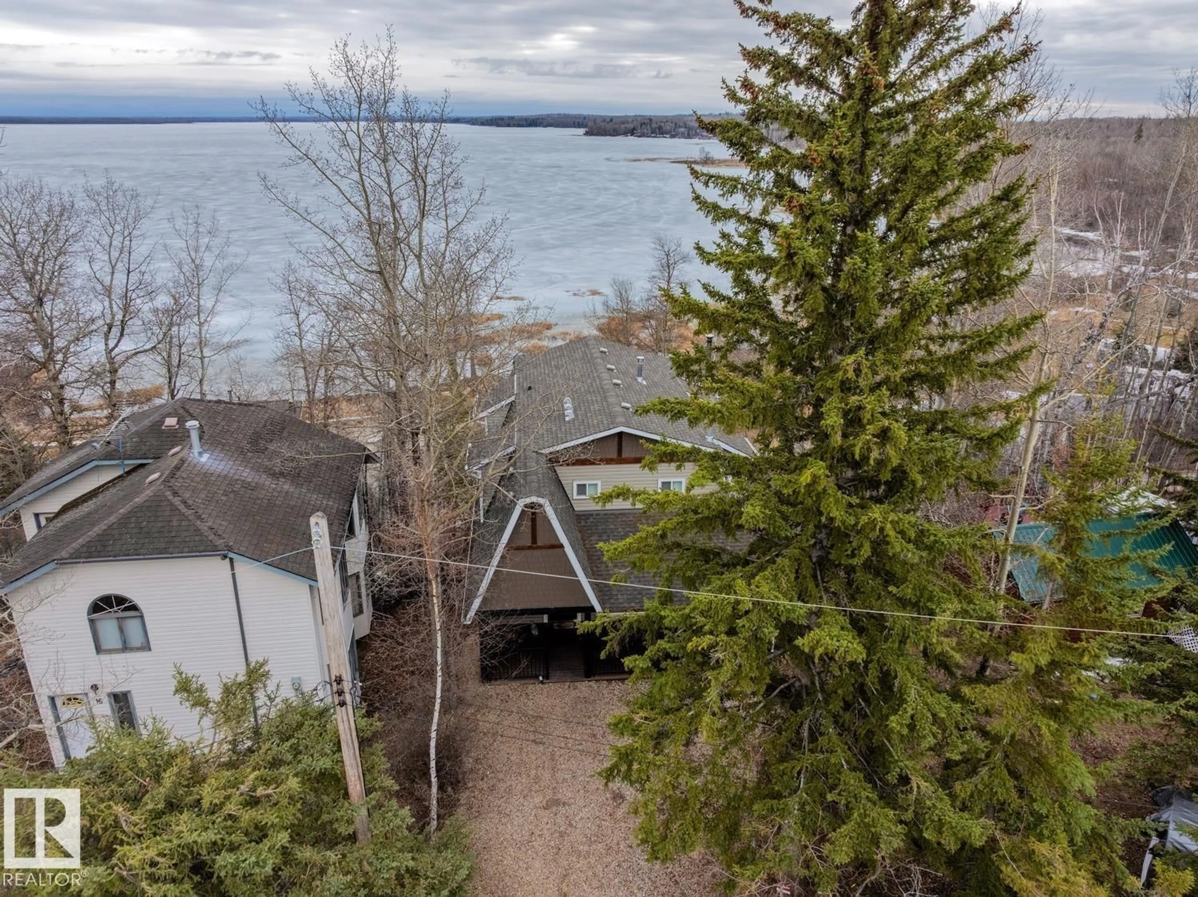A pic from outside/outdoor area/front of a property/back of a property/a pic from drone, water/lake/river/ocean view for 14 SPRUCE RD, Rural Lac Ste. Anne County Alberta T0E0X0