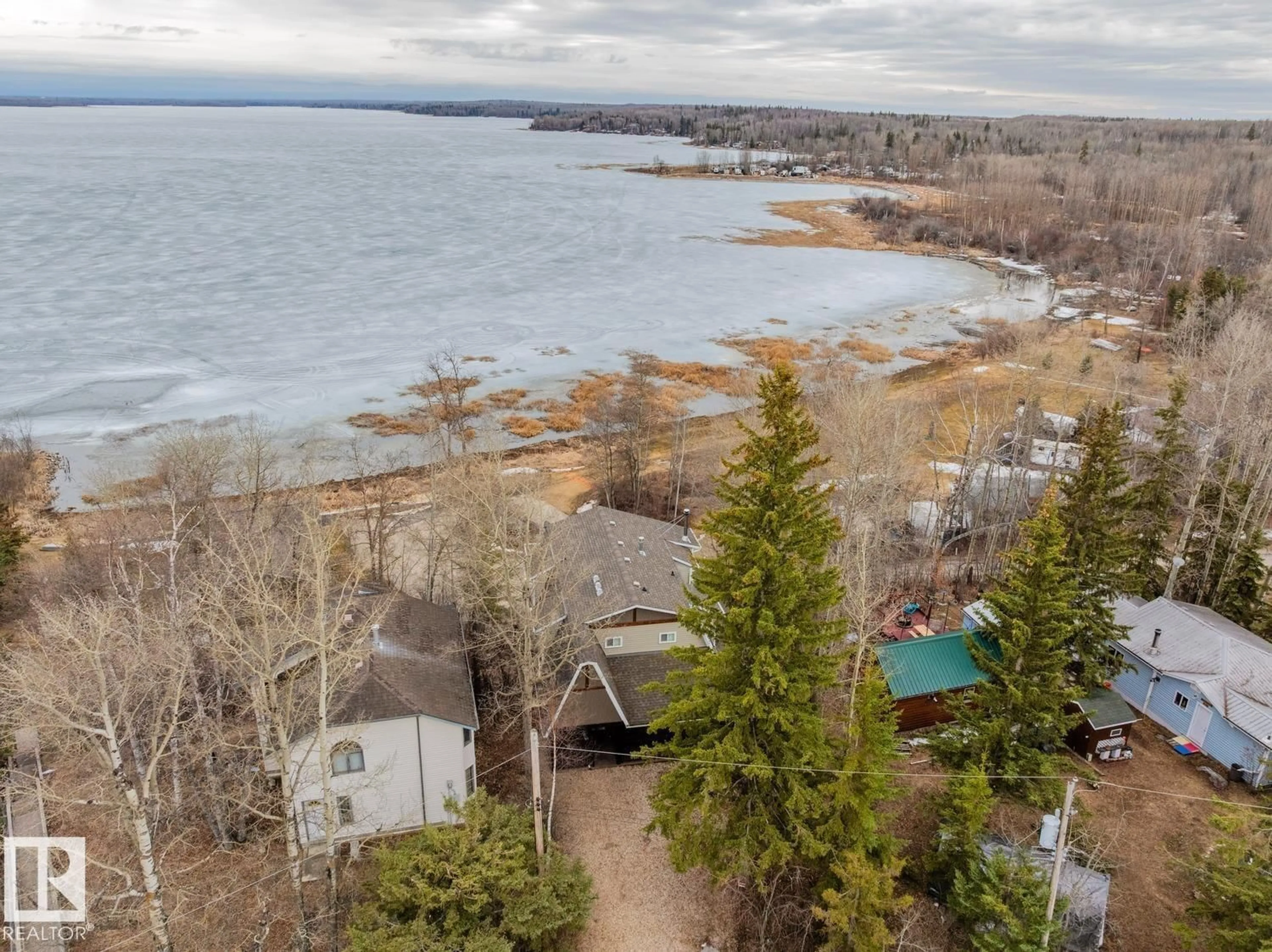 A pic from outside/outdoor area/front of a property/back of a property/a pic from drone, water/lake/river/ocean view for 14 SPRUCE RD, Rural Lac Ste. Anne County Alberta T0E0X0