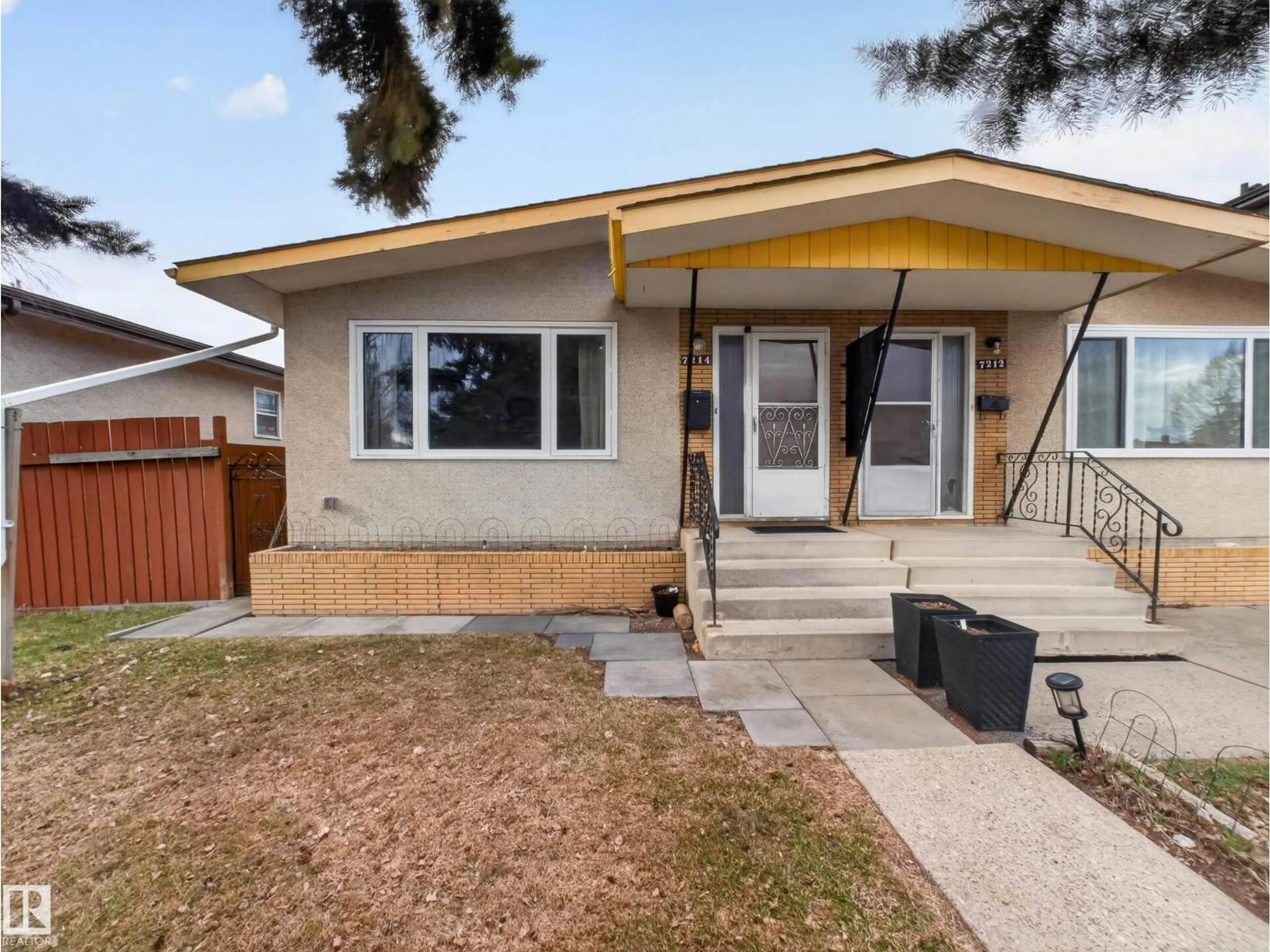 Home with vinyl exterior material, street for 7214 78 AV, Edmonton Alberta T6B0B9