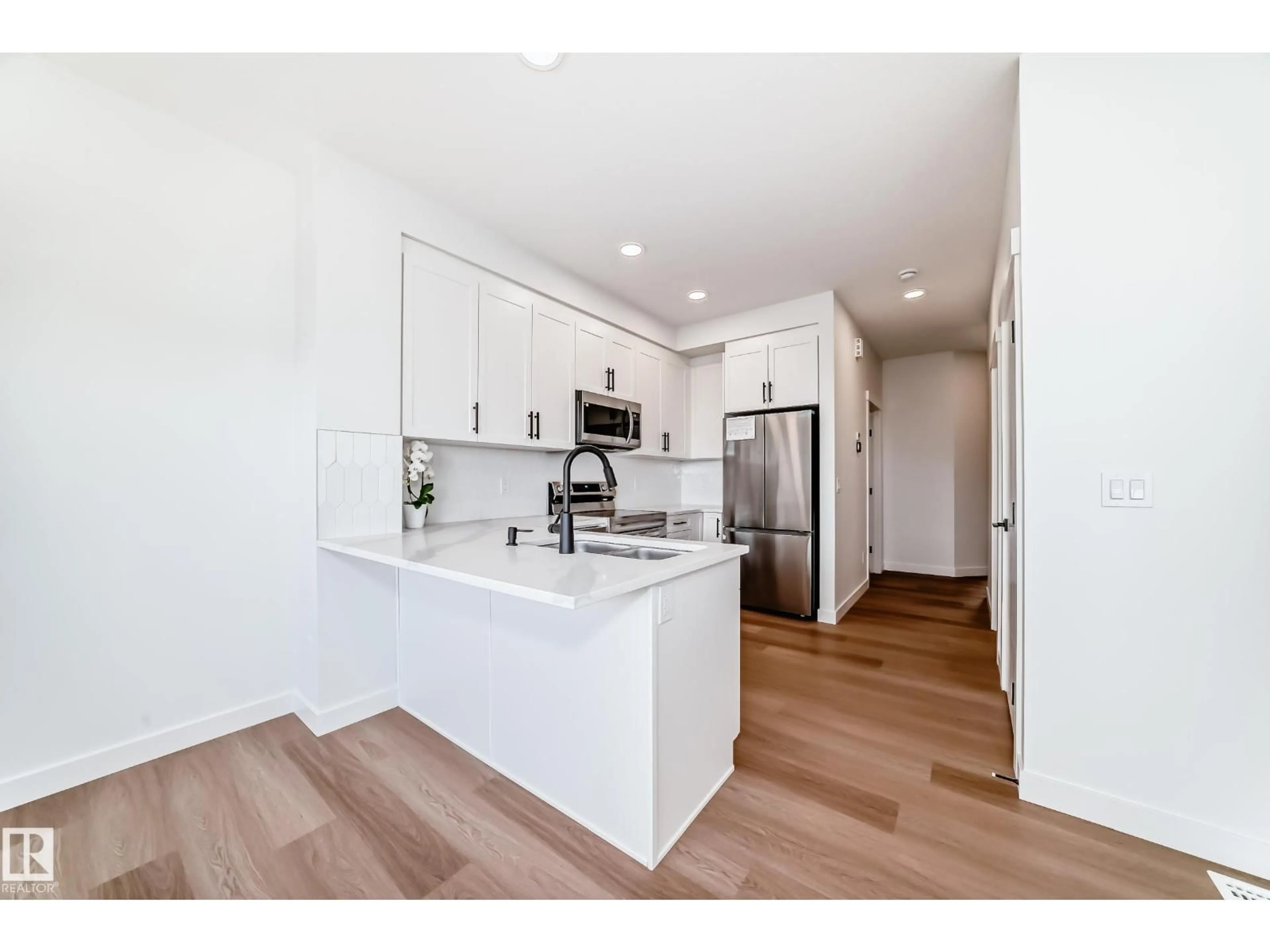 Open concept kitchen, wood/laminate floor for 34 MATTSON DR, Edmonton Alberta T6X1A3