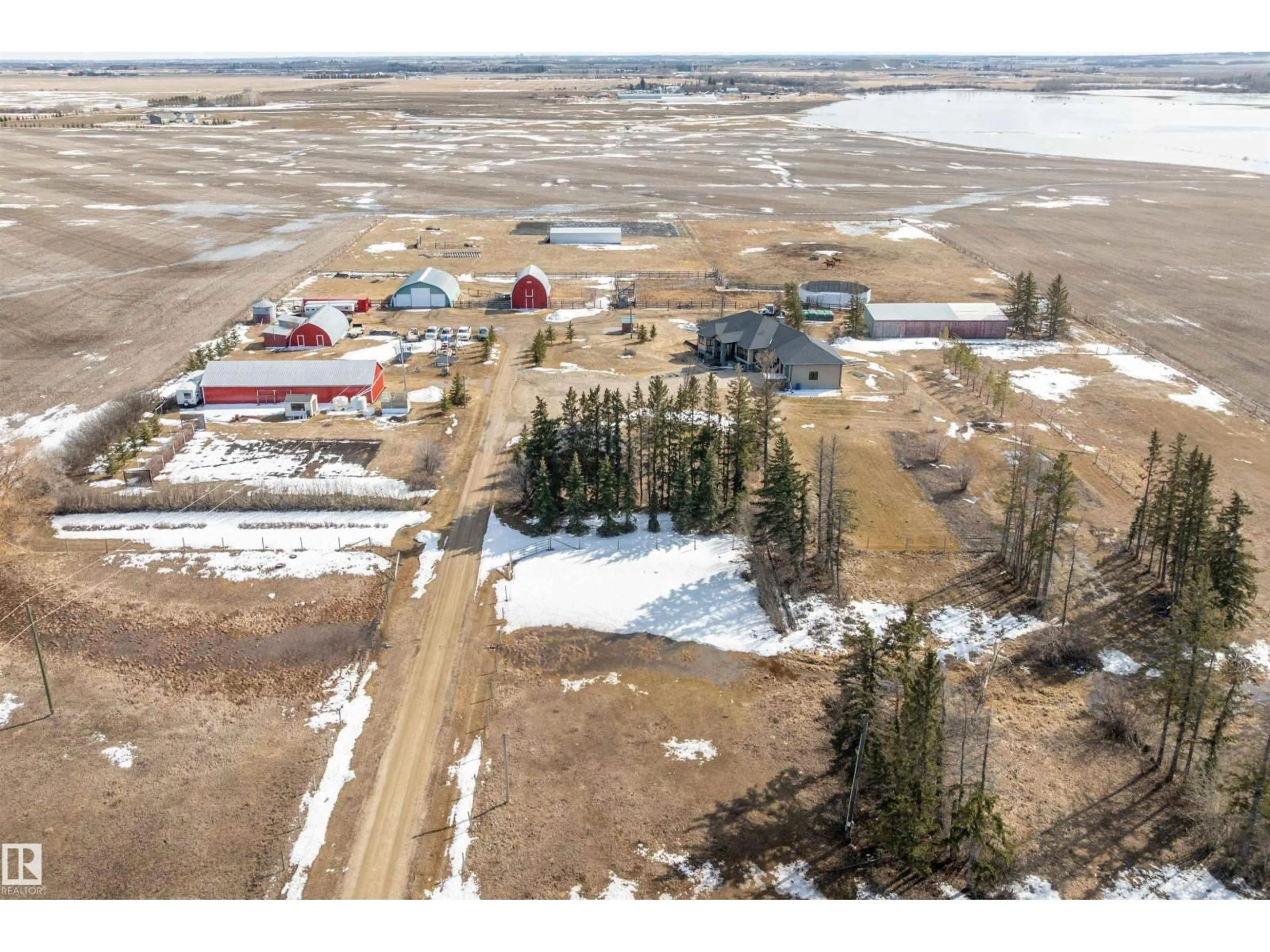 A pic from outside/outdoor area/front of a property/back of a property/a pic from drone, unknown for 26409 HWY 37, Rural Sturgeon County Alberta T8T0H6