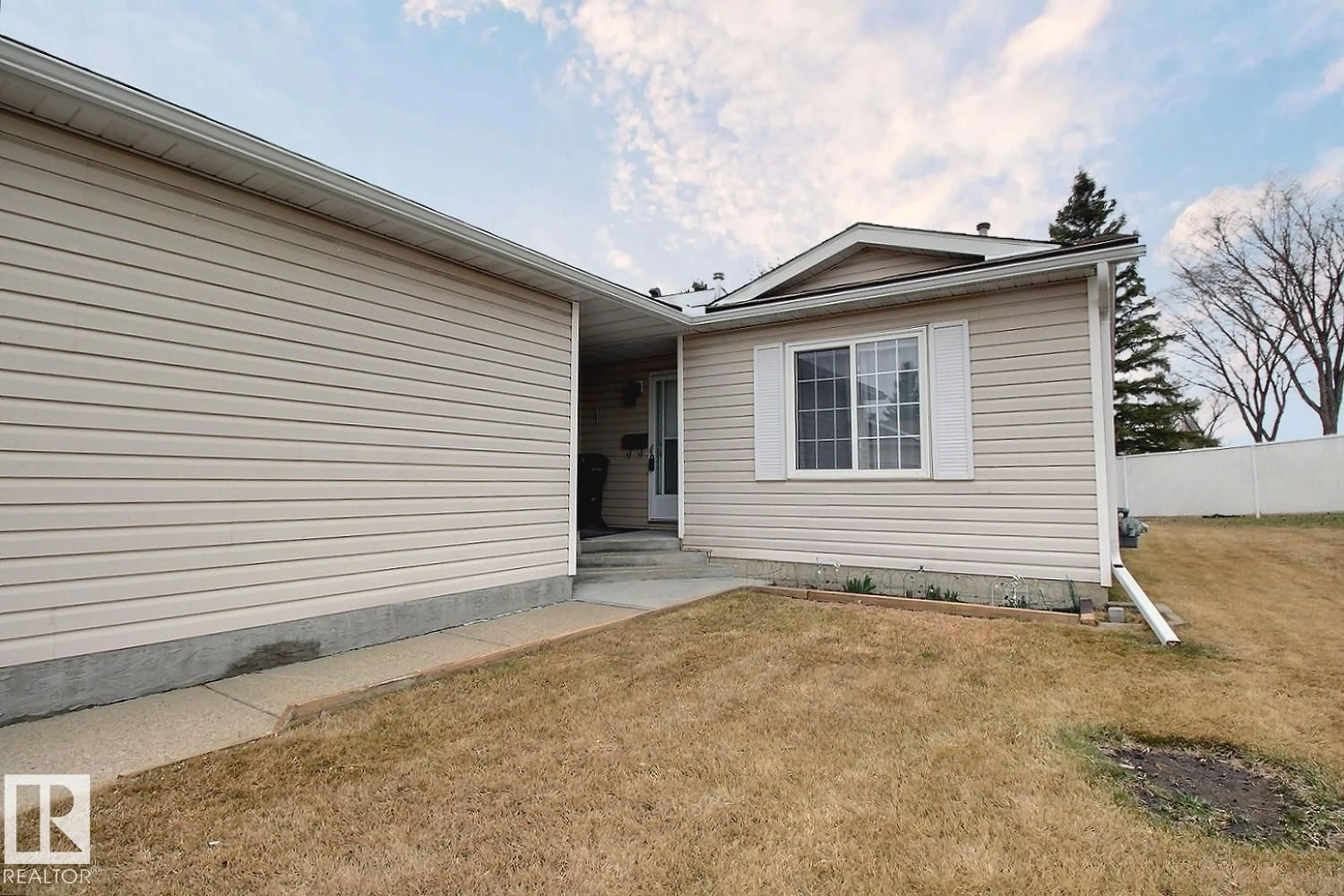 Home with vinyl exterior material, street for 8146 27 AV, Edmonton Alberta T6K4C9