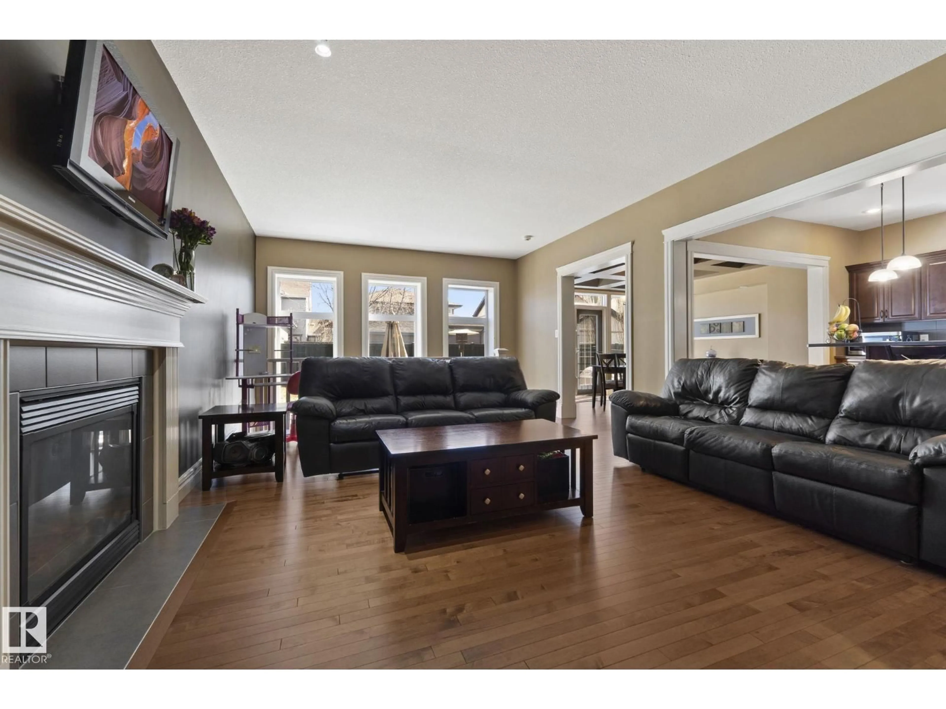 Living room with furniture, wood/laminate floor for SW - 2011 126 ST, Edmonton Alberta T6W0A5
