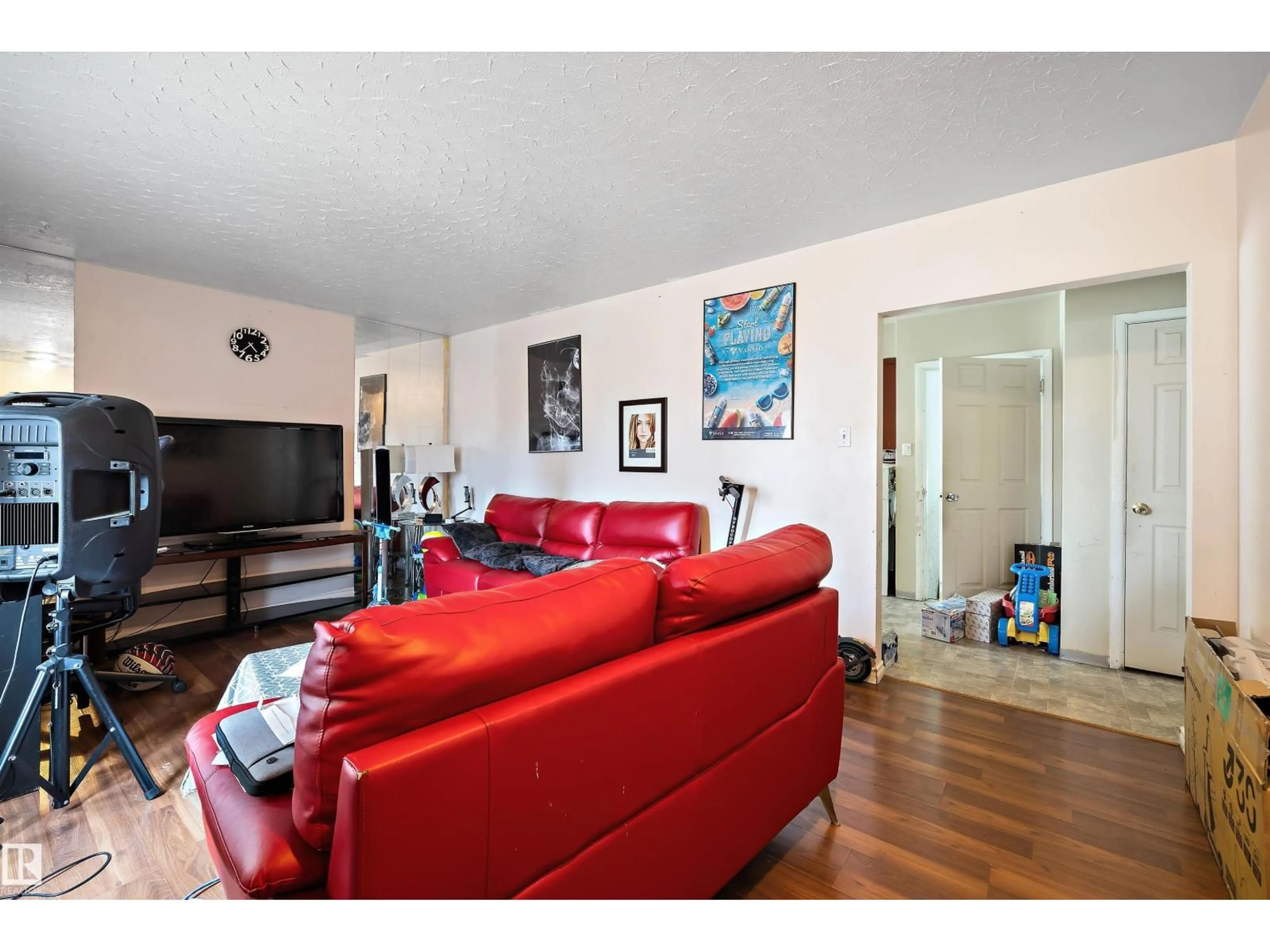 Living room with furniture, wood/laminate floor for 13136 60 ST, Edmonton Alberta T5A0S3