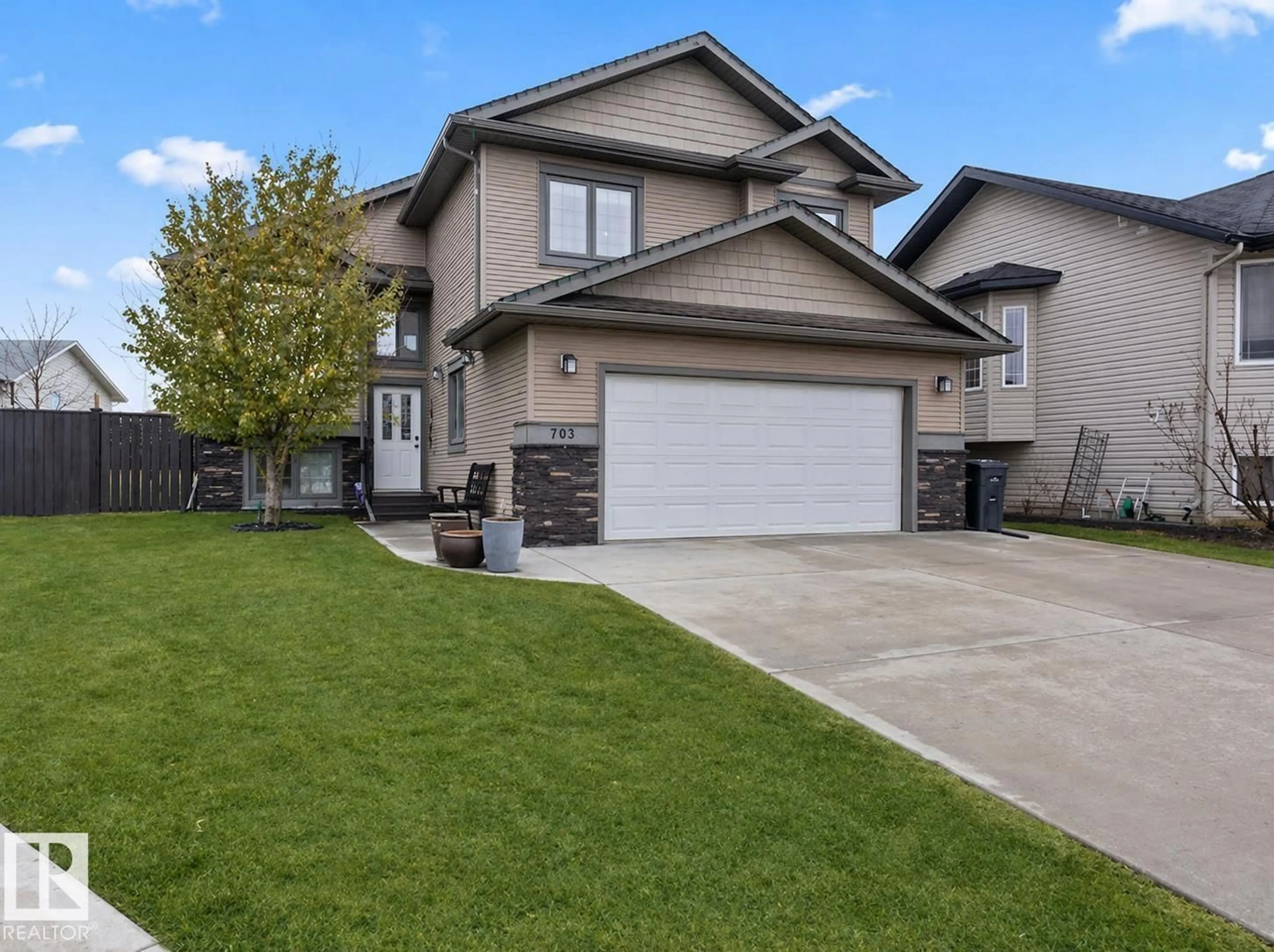 Home with vinyl exterior material, street for 705 PHEASANT CL, Cold Lake Alberta T9M0B7