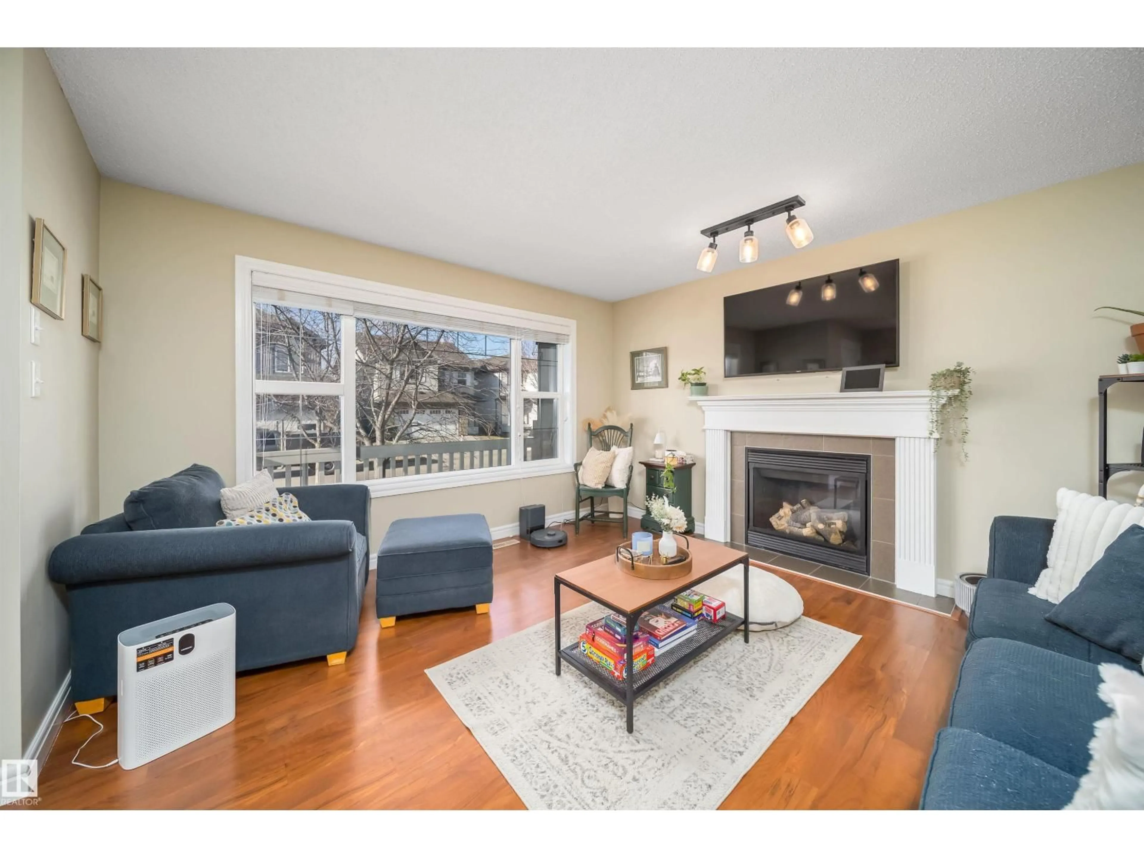Living room with furniture, wood/laminate floor for 39 VIRGINIA AV, Spruce Grove Alberta T7X0B9