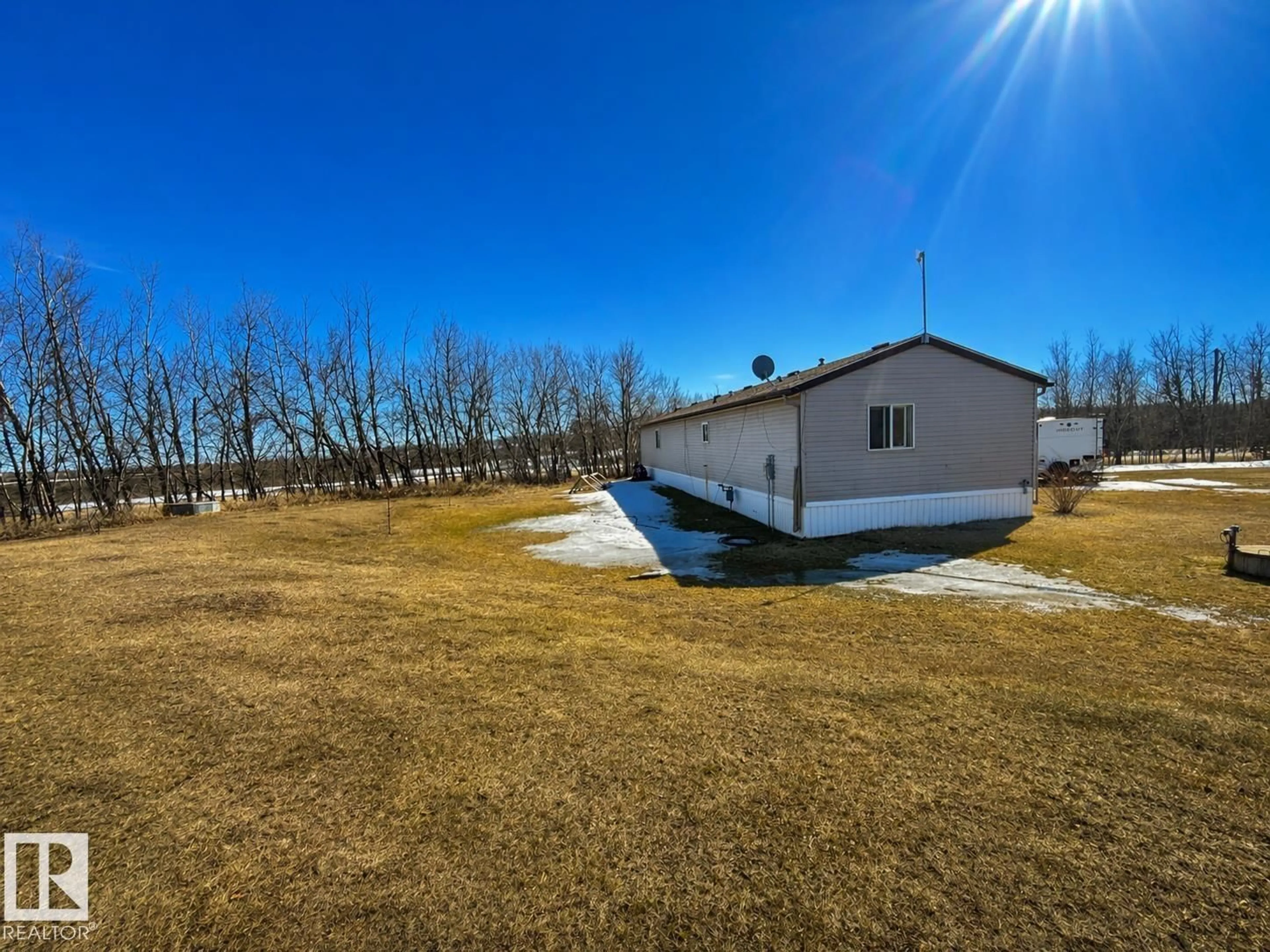 A pic from outside/outdoor area/front of a property/back of a property/a pic from drone, water/lake/river/ocean view for 4703 51 AV, La Corey Alberta T0A2E0