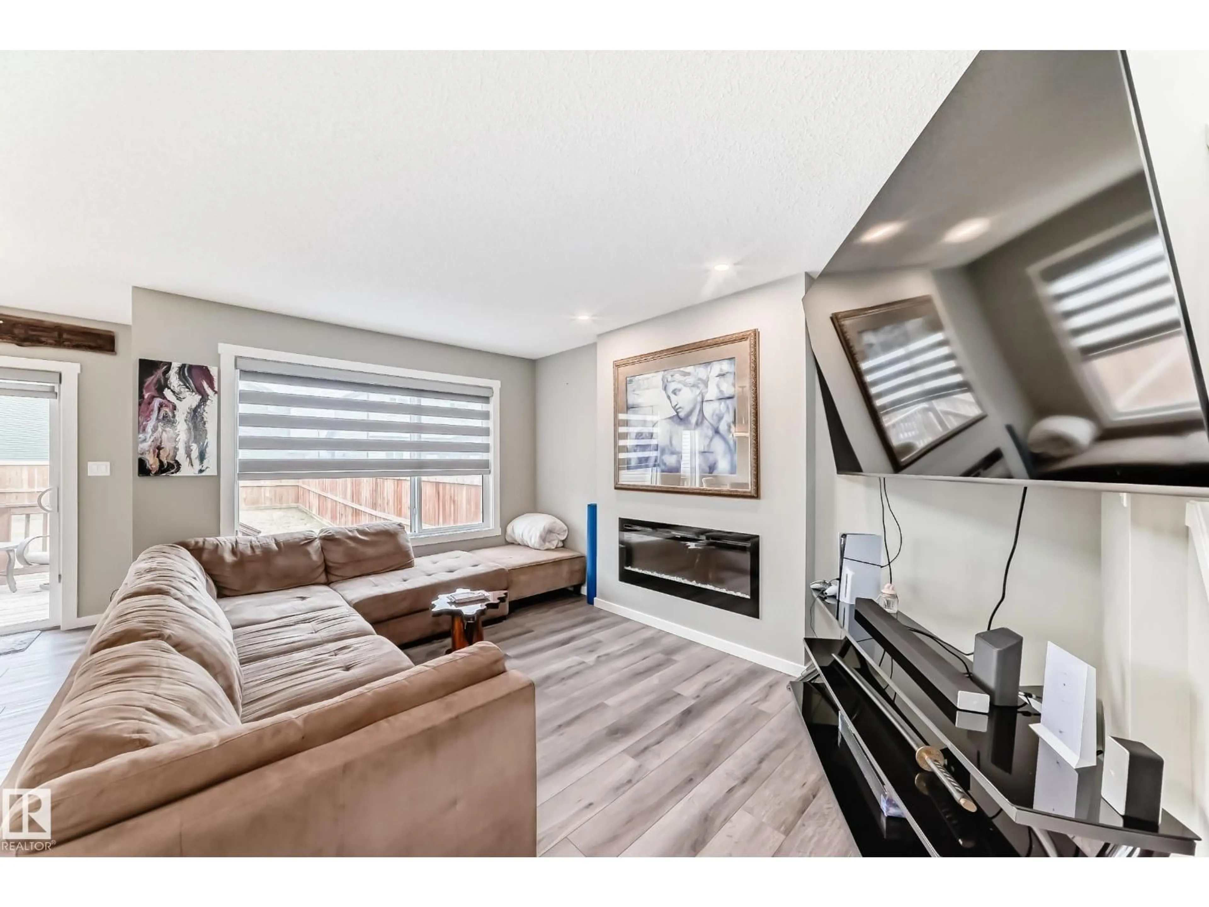 Living room with furniture, wood/laminate floor for 9 ROLSTON CO, Leduc Alberta T9E1L1