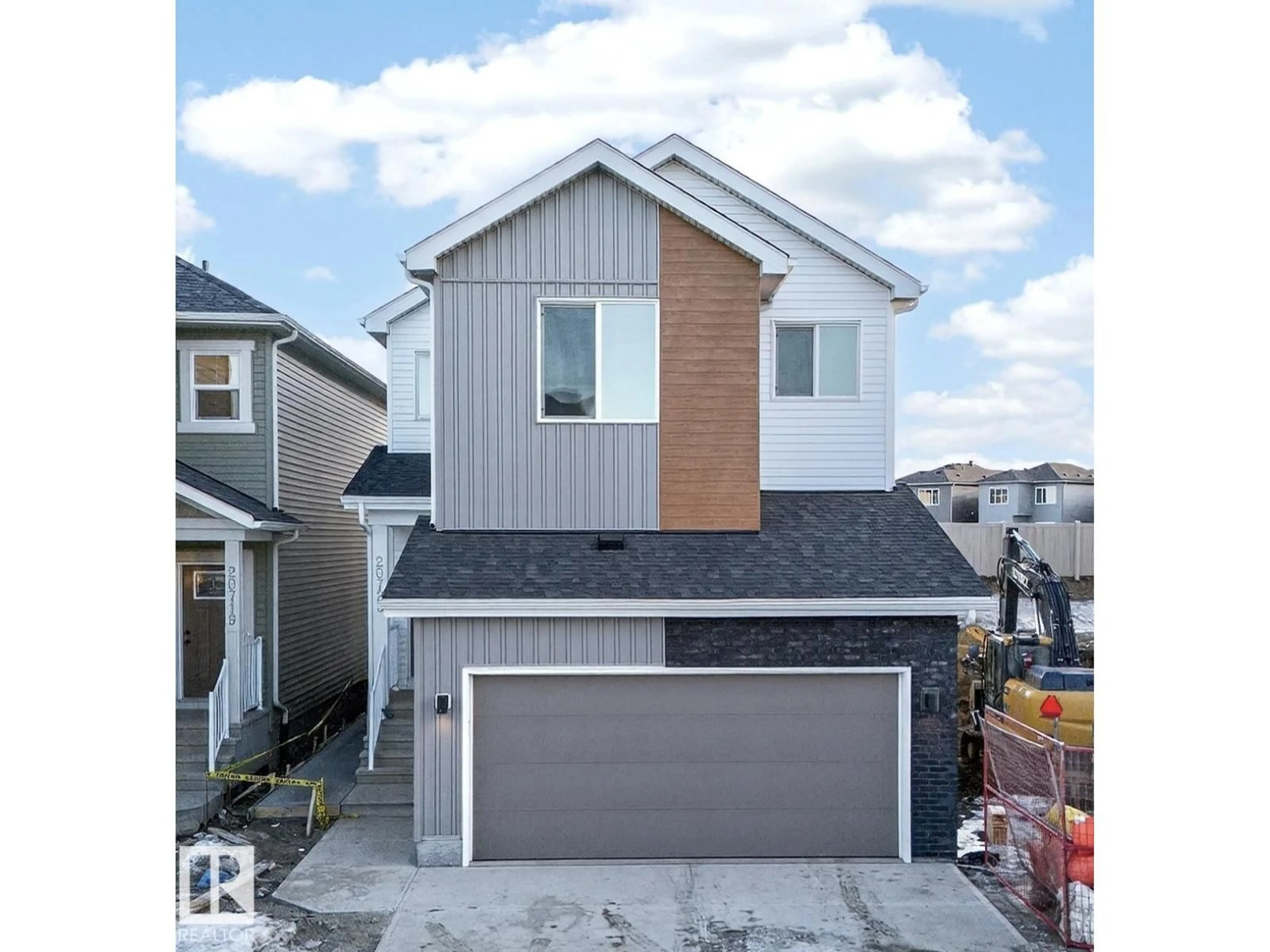 Home with vinyl exterior material, street for NW - 20723 24 AV, Edmonton Alberta T6M2C4