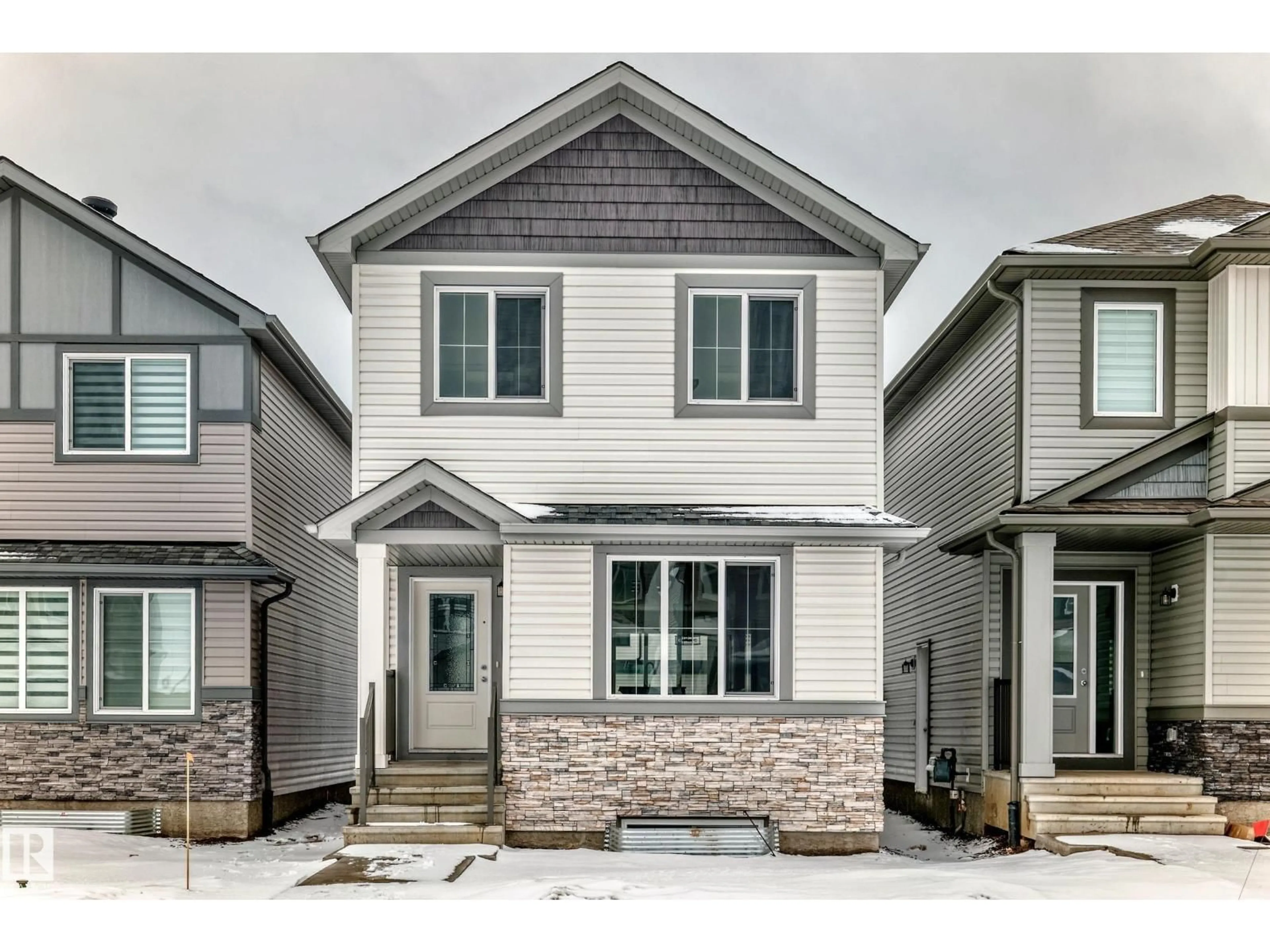 Home with vinyl exterior material, street for 4611 177AVE NW, Edmonton Alberta T5Y4B7