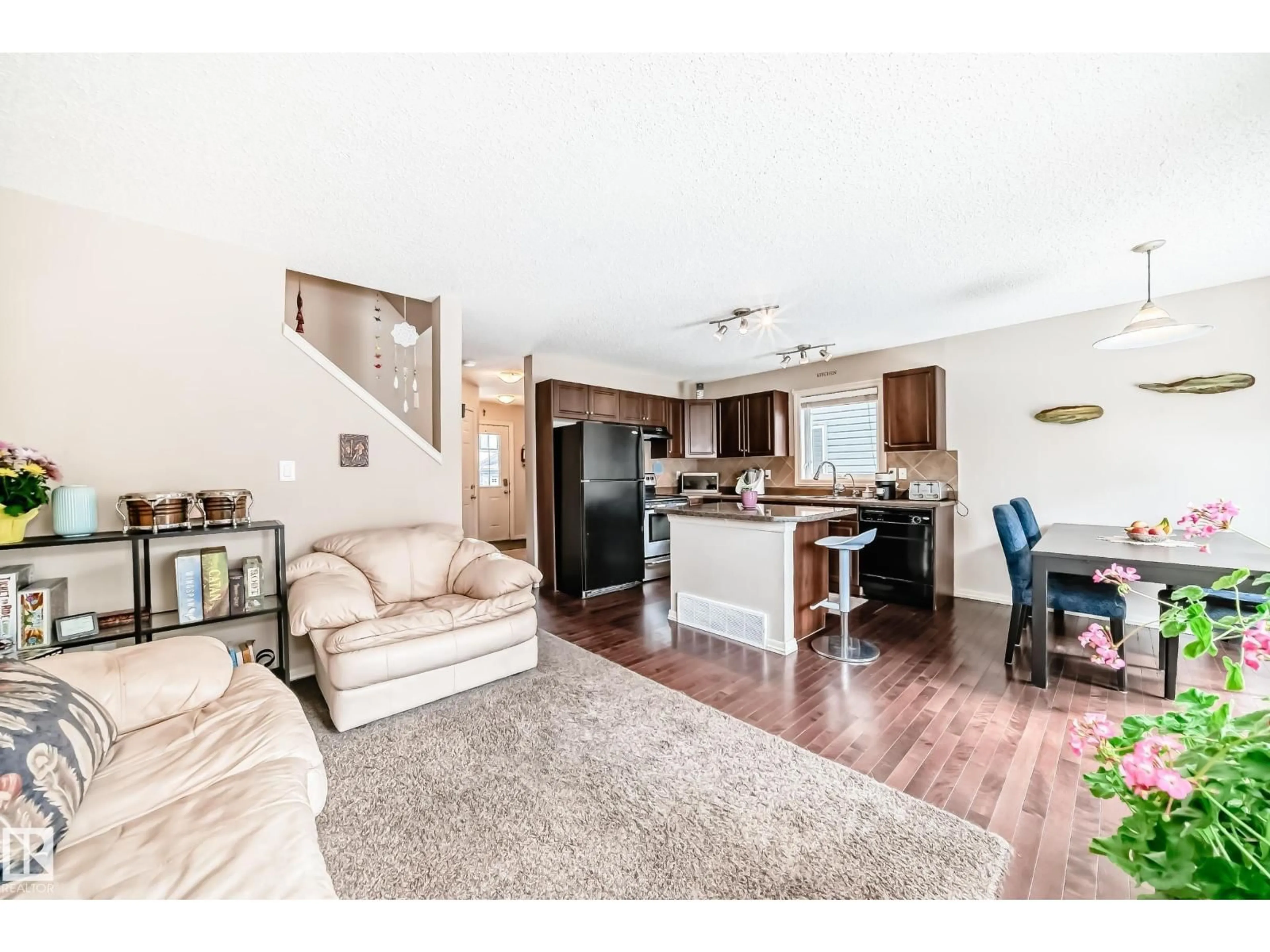 Open concept kitchen, wood/laminate floor for #13 - 1730 LEGER GATE, Edmonton Alberta T6R0R3