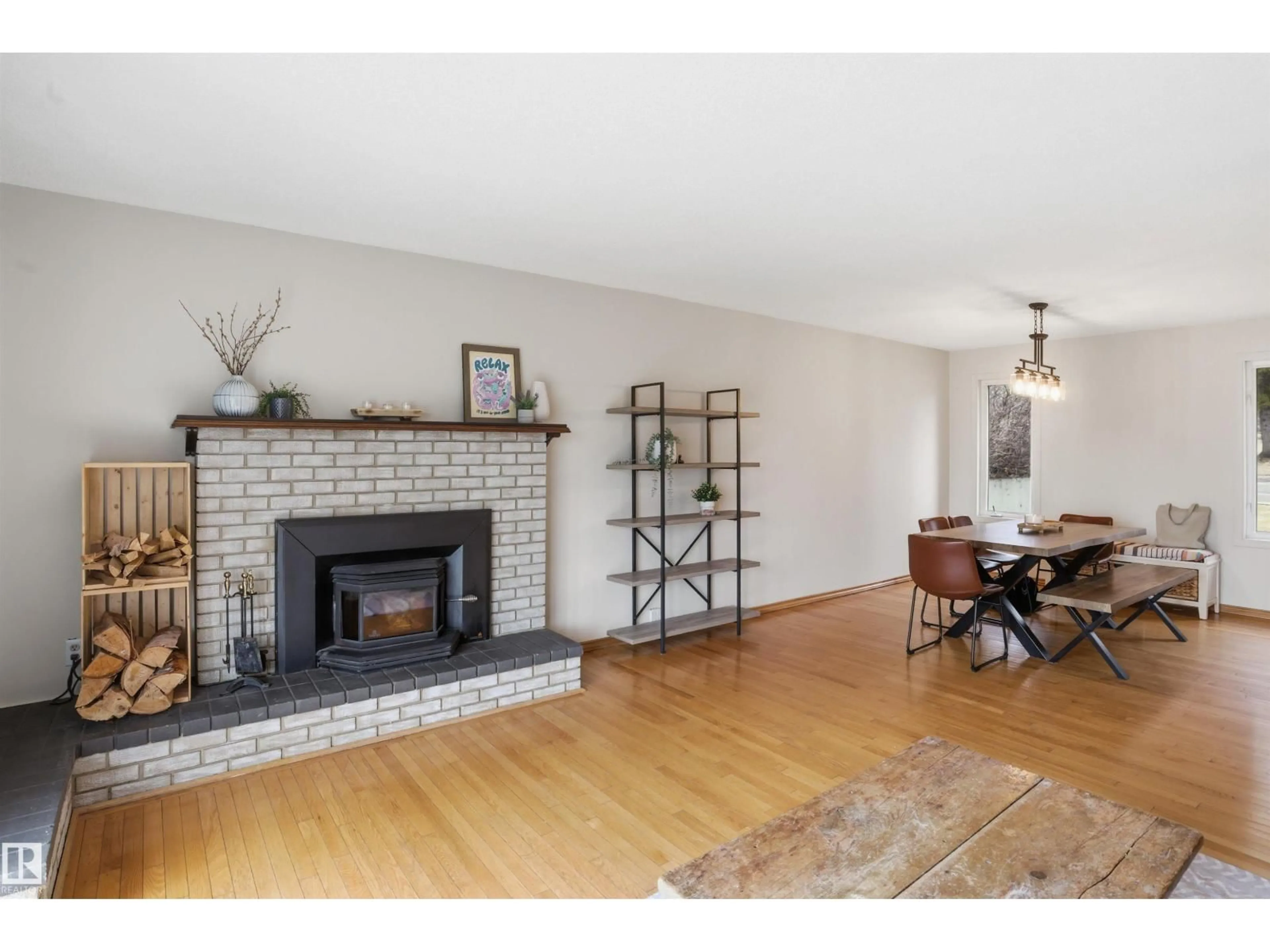 Living room with furniture, wood/laminate floor for 23 CLEARWATER, Devon Alberta T9G1C8