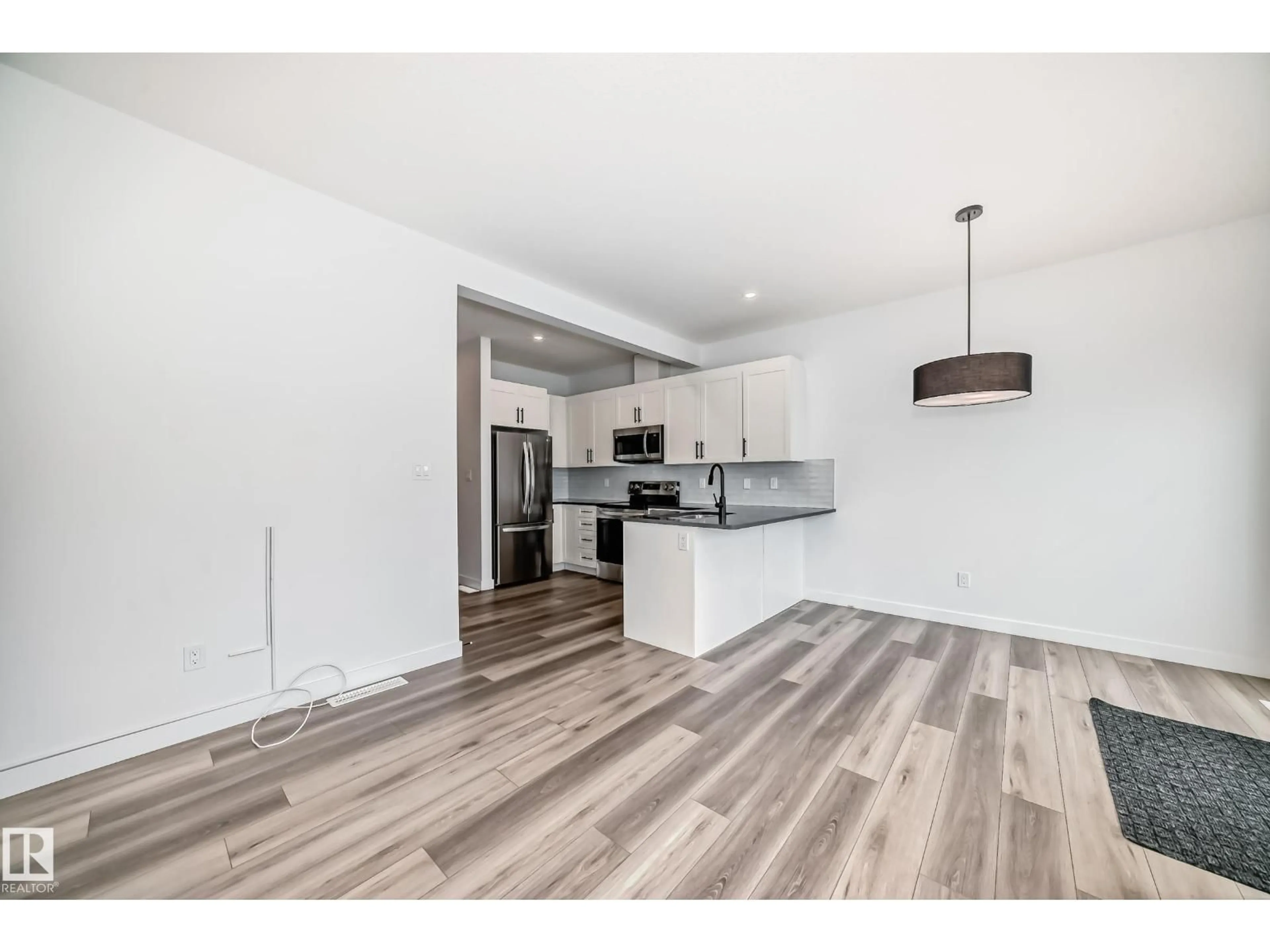 Open concept kitchen, wood/laminate floor for 1910 - 38 COLLIP VW, Edmonton Alberta T6W5H4