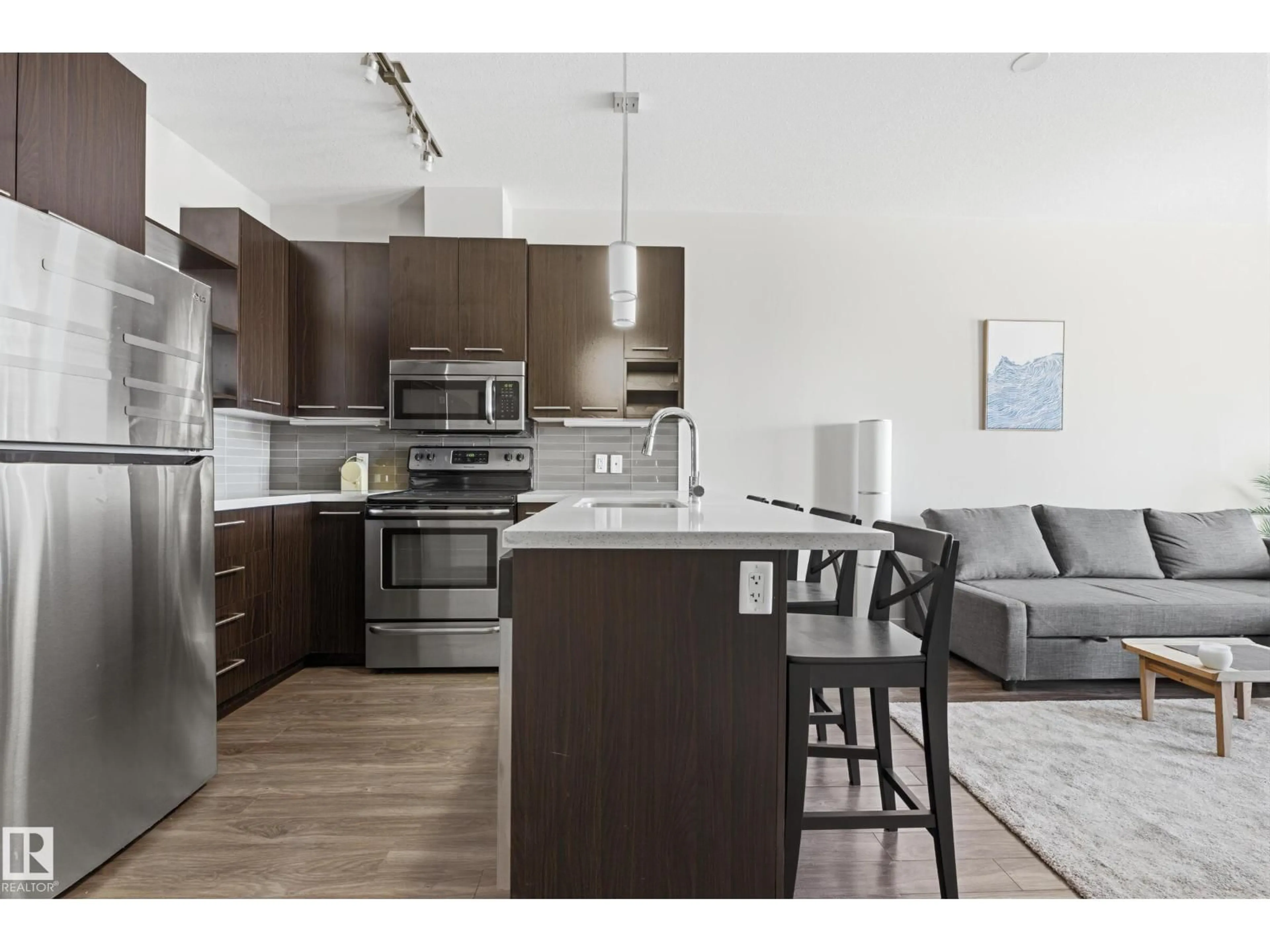 Open concept kitchen, wood/laminate floor for #403 - 10418 81 AV, Edmonton Alberta T6E1X5