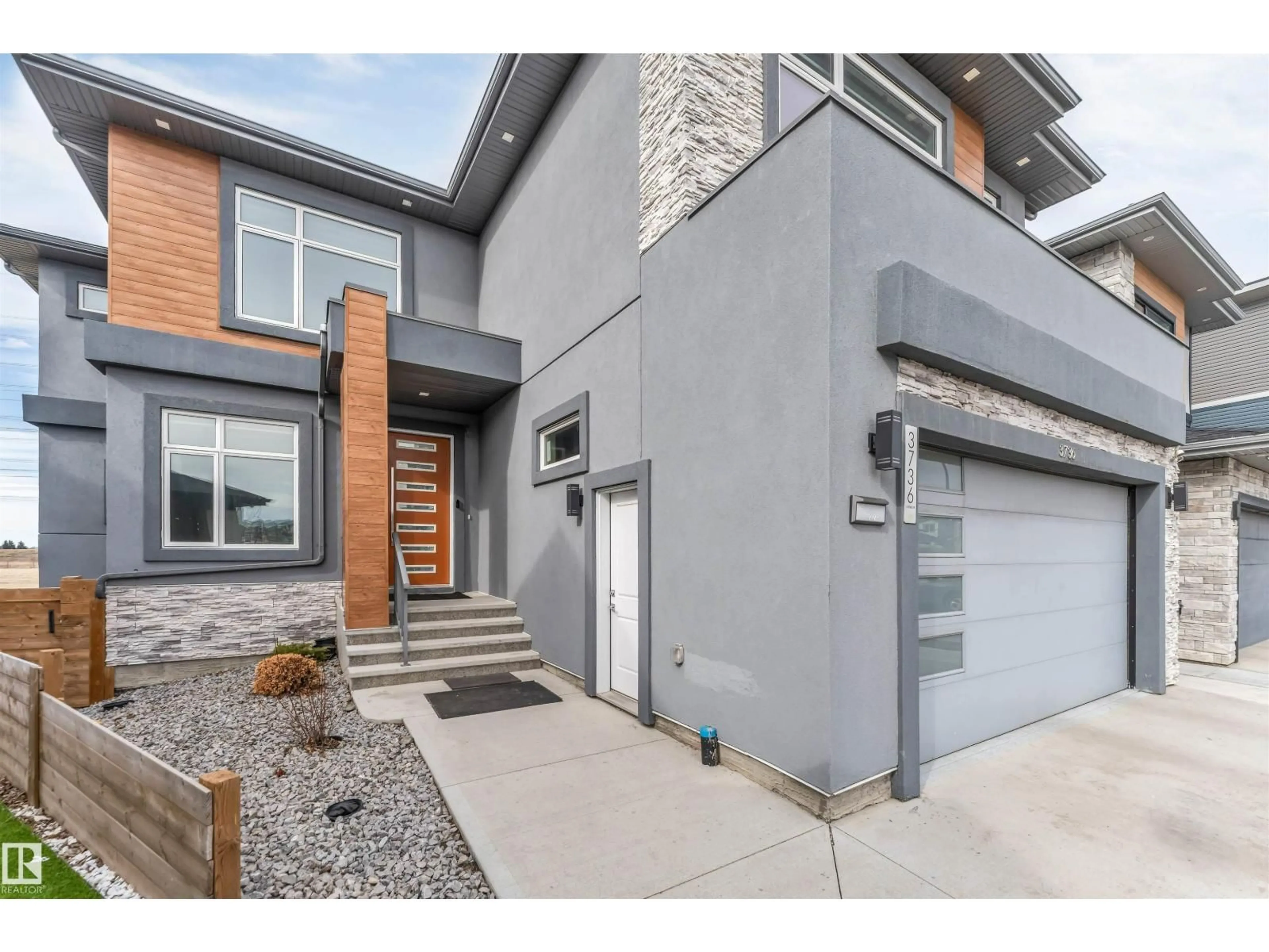 Home with brick exterior material, street for 3736 1 AV SW, Edmonton Alberta T6X2W3