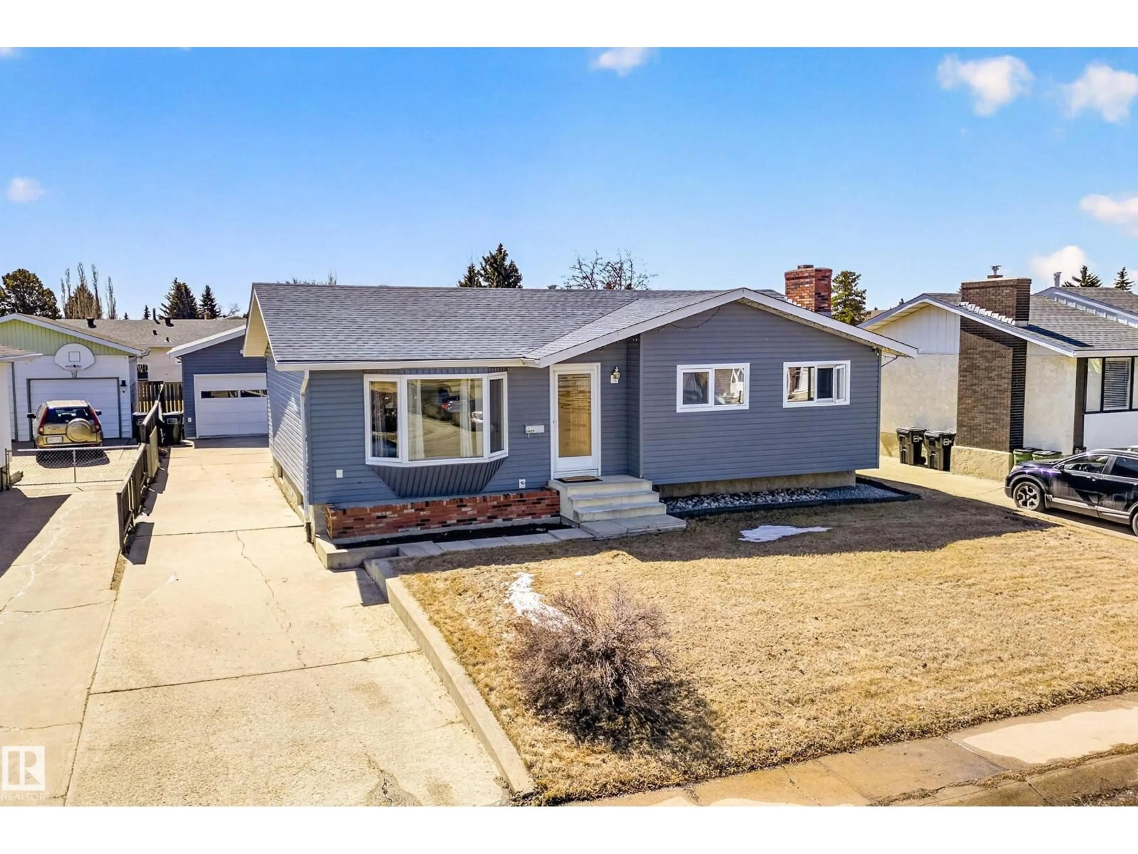 Home with vinyl exterior material, street for 11427 161 AV, Edmonton Alberta T5X2K9