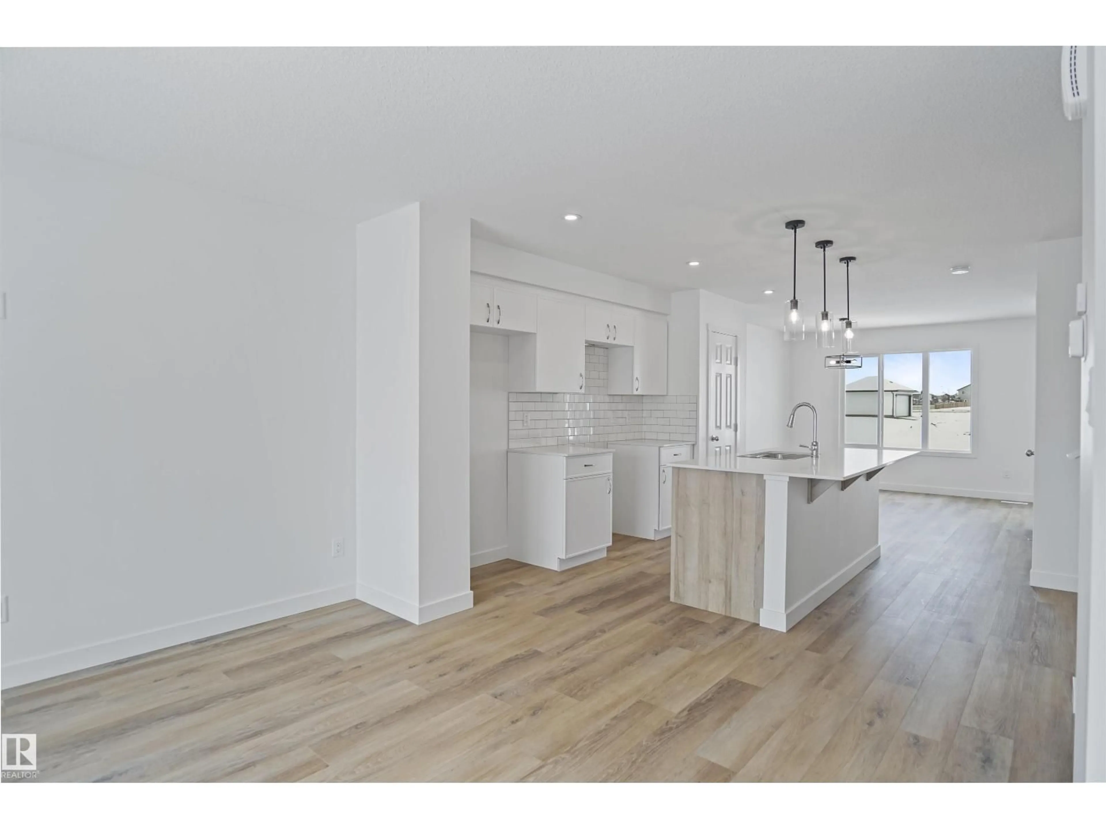 Open concept kitchen, wood/laminate floor for 29 FICUS WY, Fort Saskatchewan Alberta T8L4M1