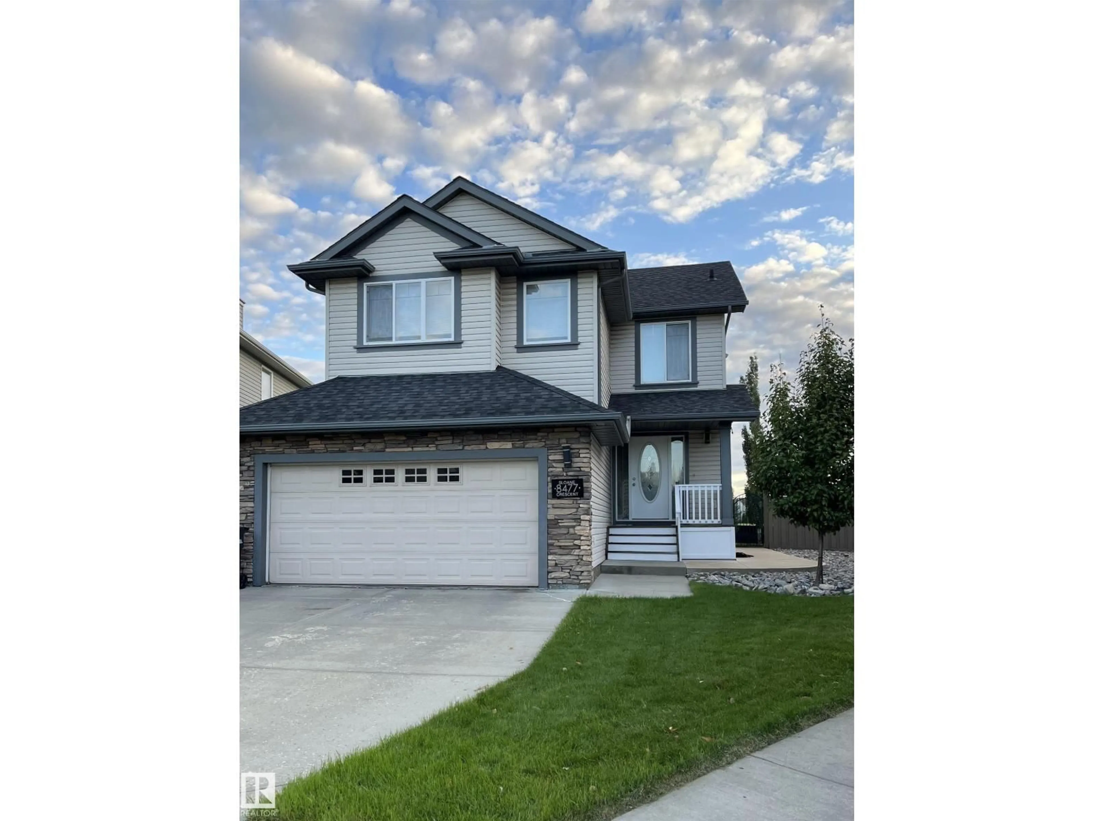 Home with vinyl exterior material, street for 8477 SLOANE CR, Edmonton Alberta T6R0L2