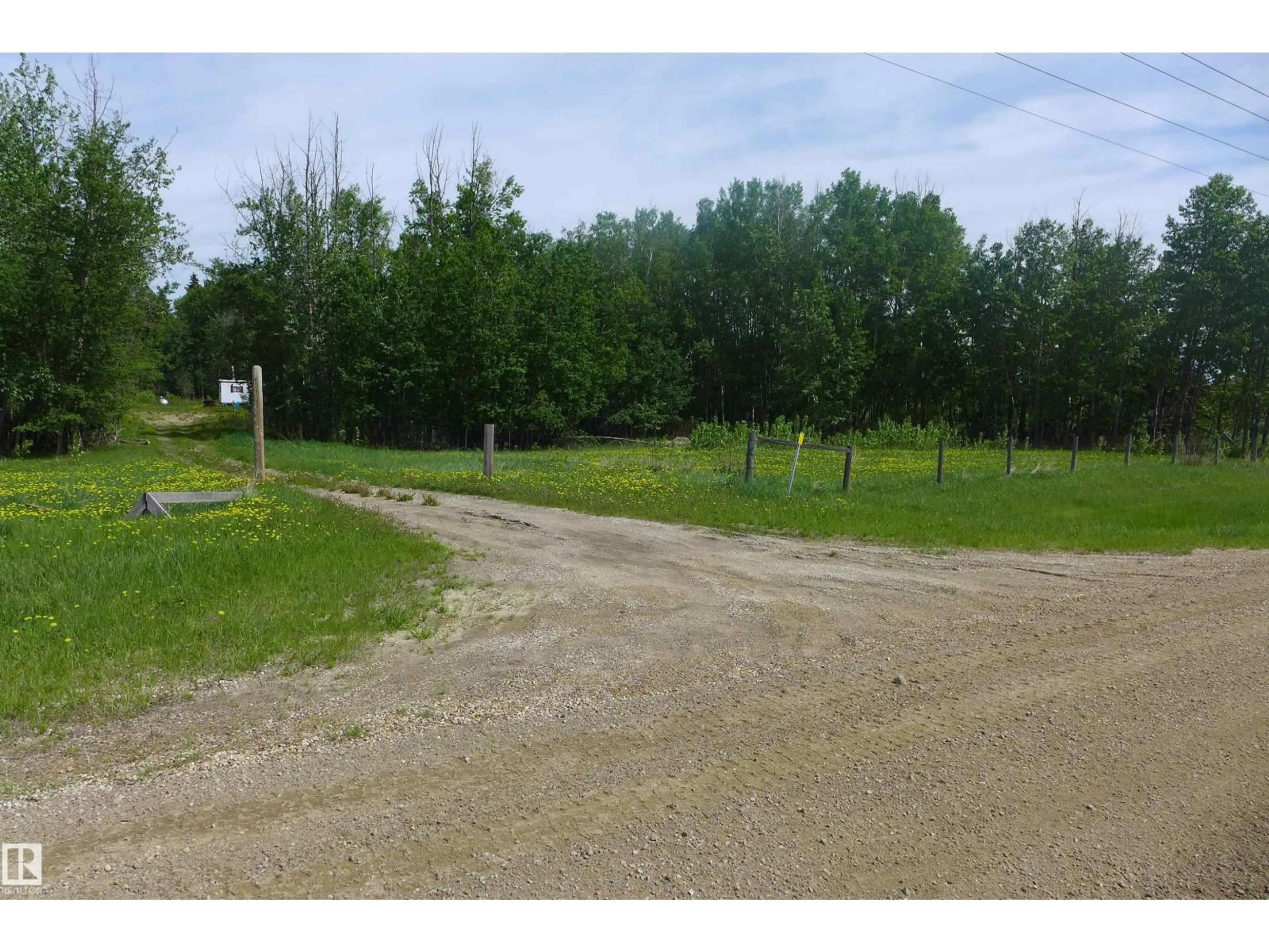 A pic from outside/outdoor area/front of a property/back of a property/a pic from drone, street for 5430 HGHWAY 16, Rural Parkland County Alberta T0E0W0
