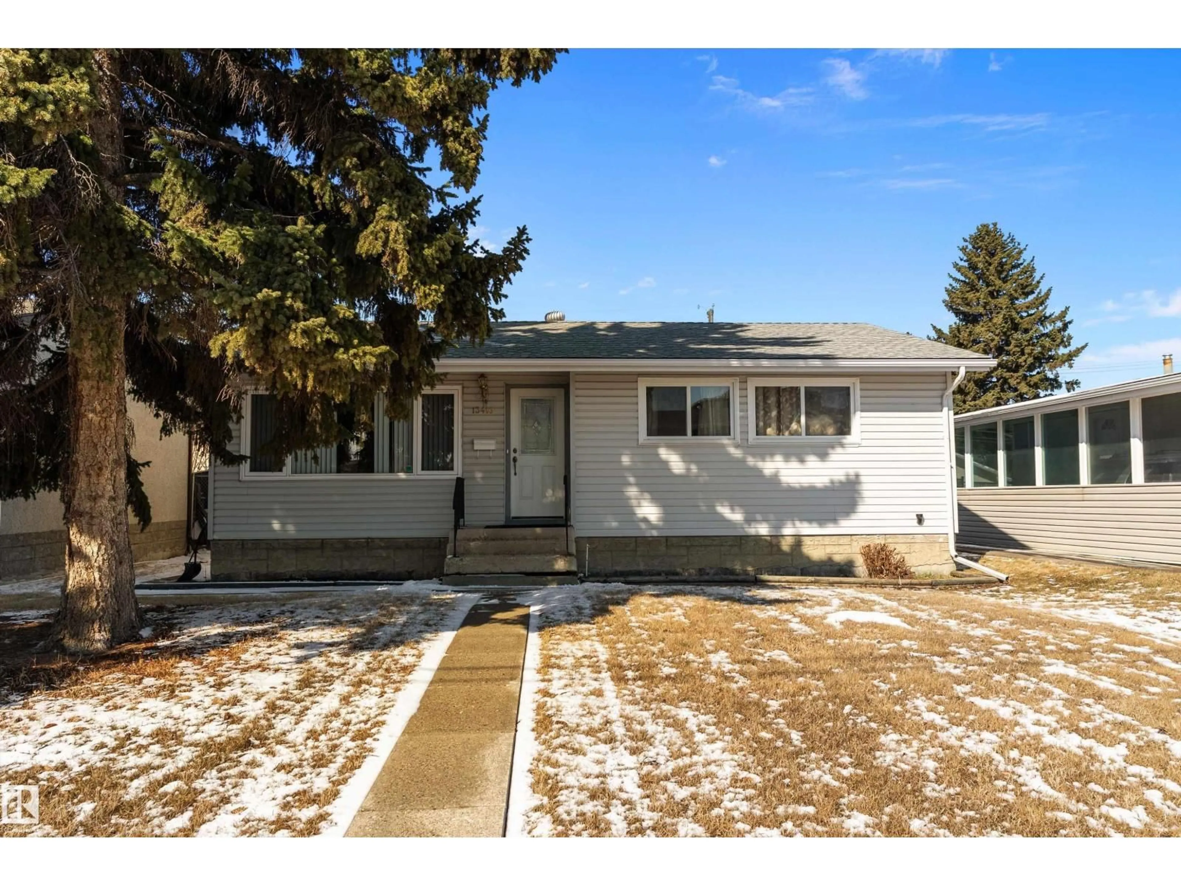 Home with vinyl exterior material, street for 13416 101 ST, Edmonton Alberta T5E4G4