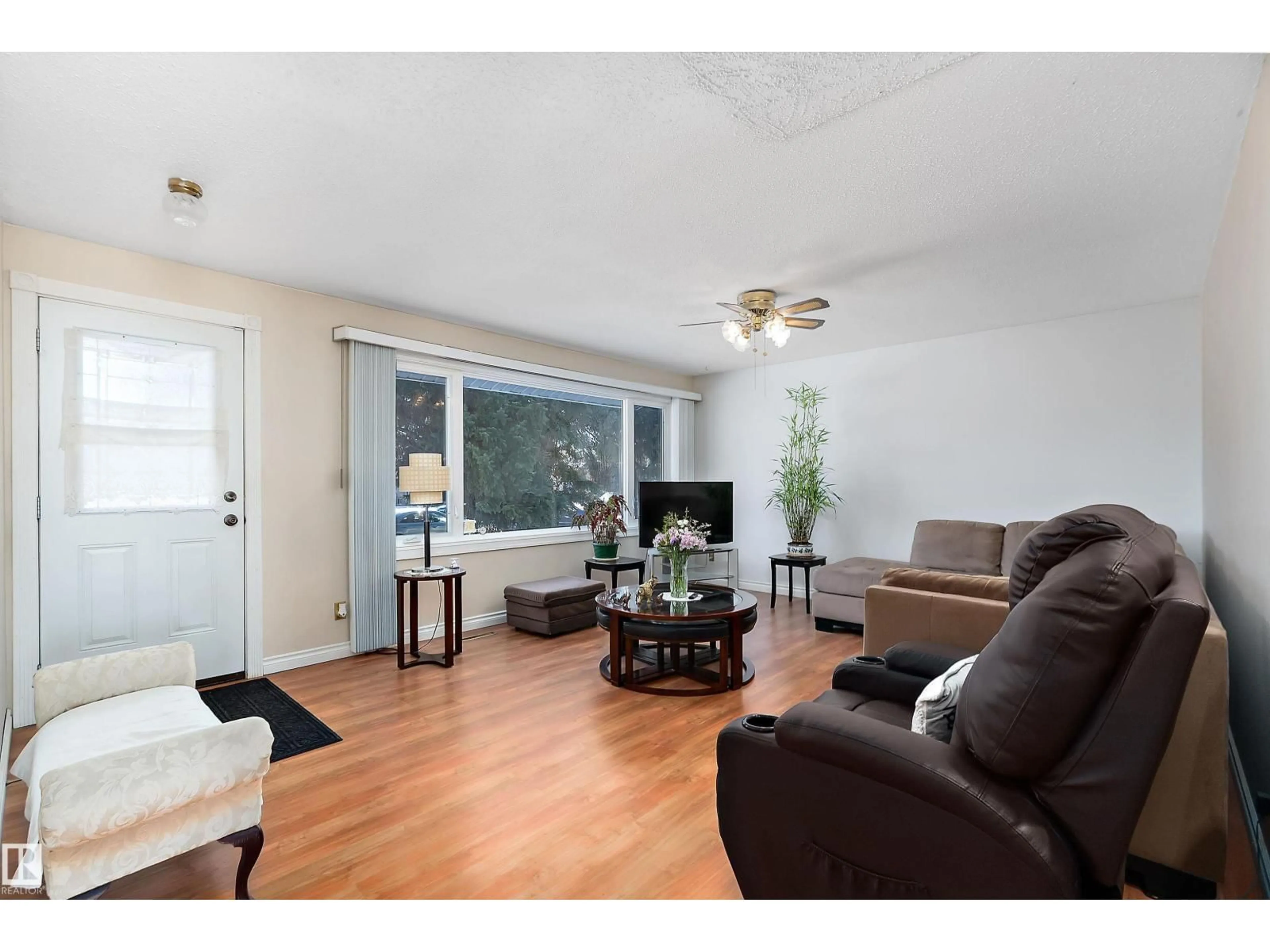 Living room with furniture, wood/laminate floor for 13416 101 ST, Edmonton Alberta T5E4G4