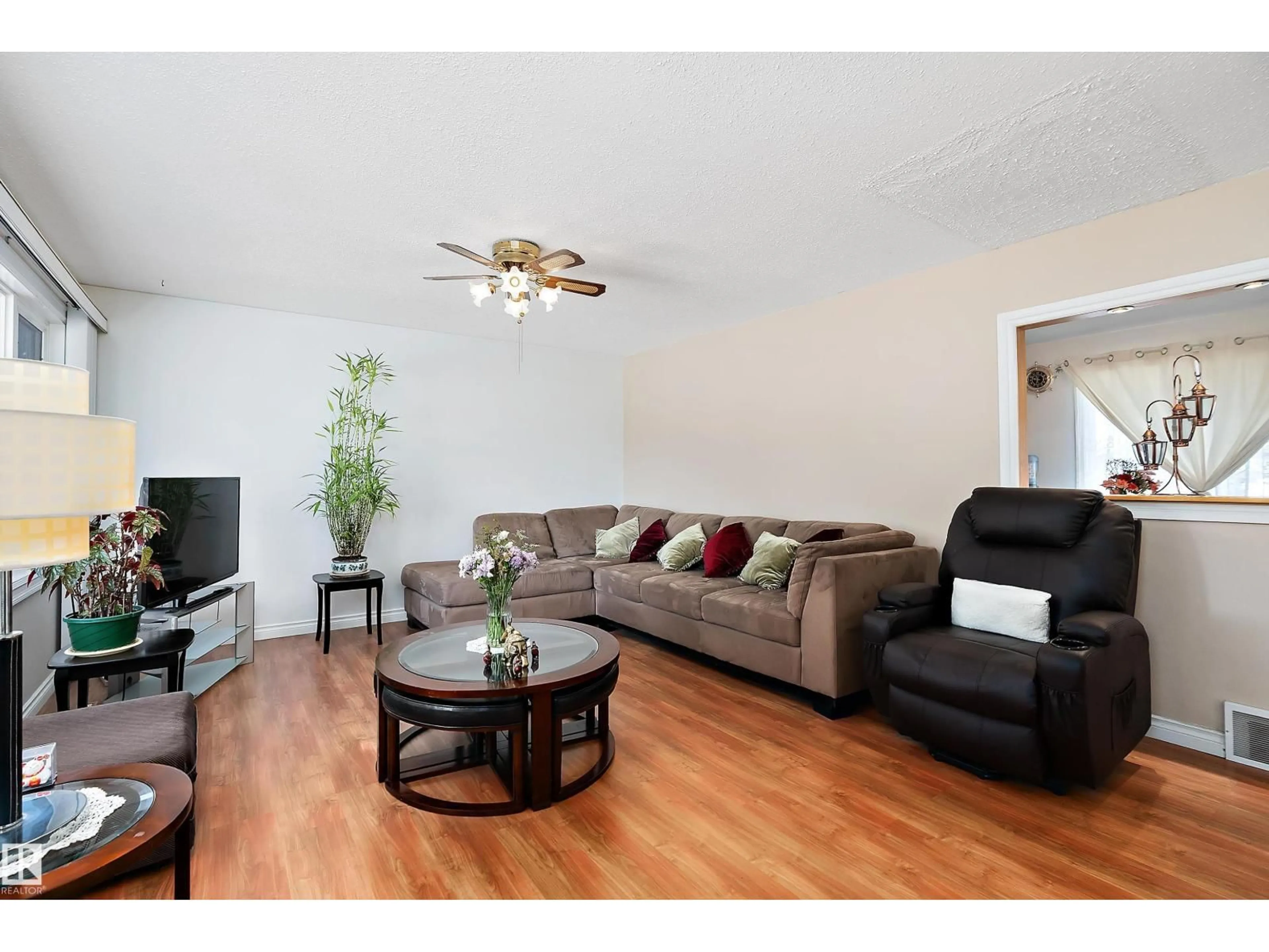 Living room with furniture, wood/laminate floor for 13416 101 ST, Edmonton Alberta T5E4G4