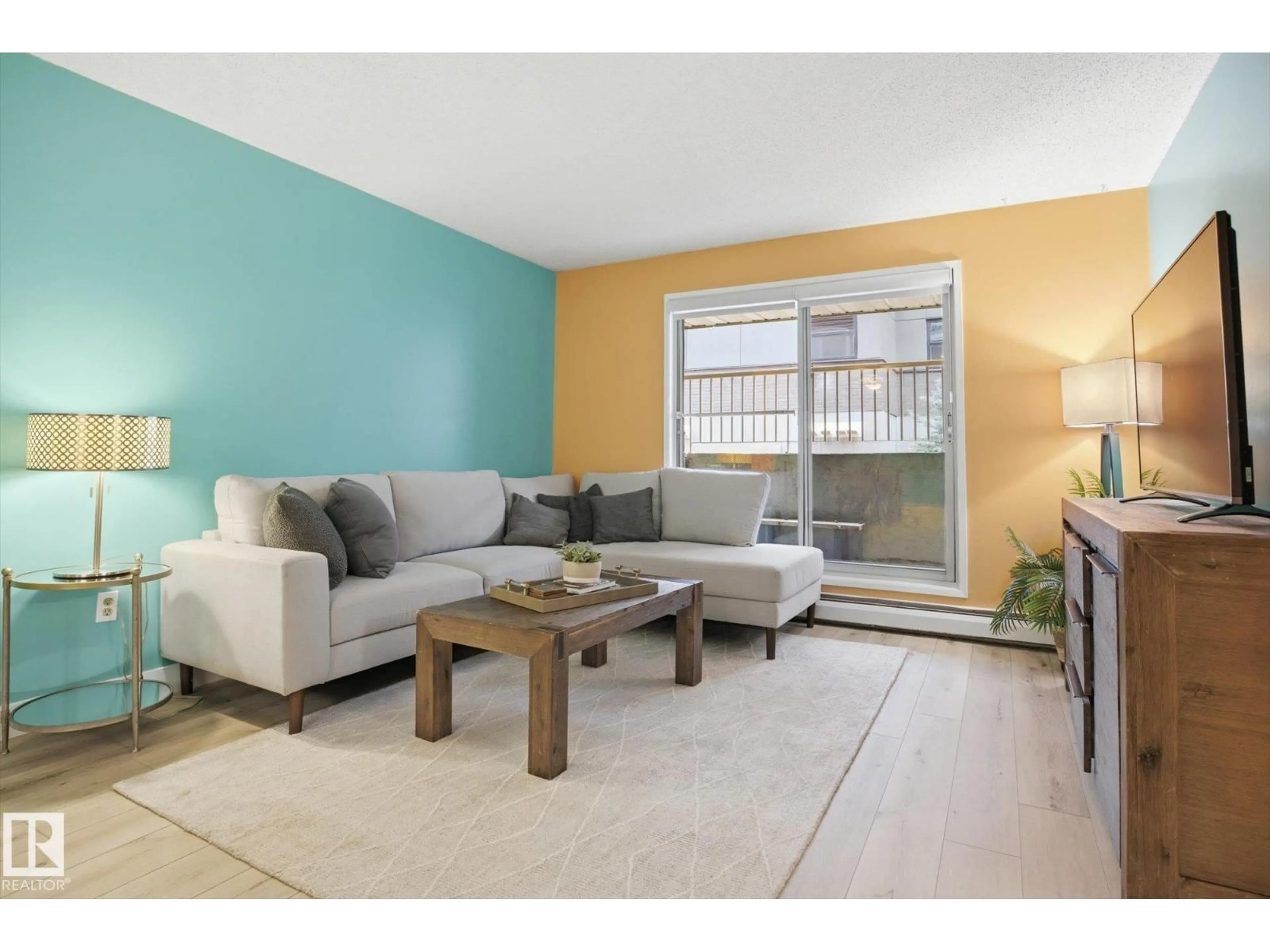 Living room with furniture, wood/laminate floor for #103 - 10732 86 AV, Edmonton Alberta T6E2M9