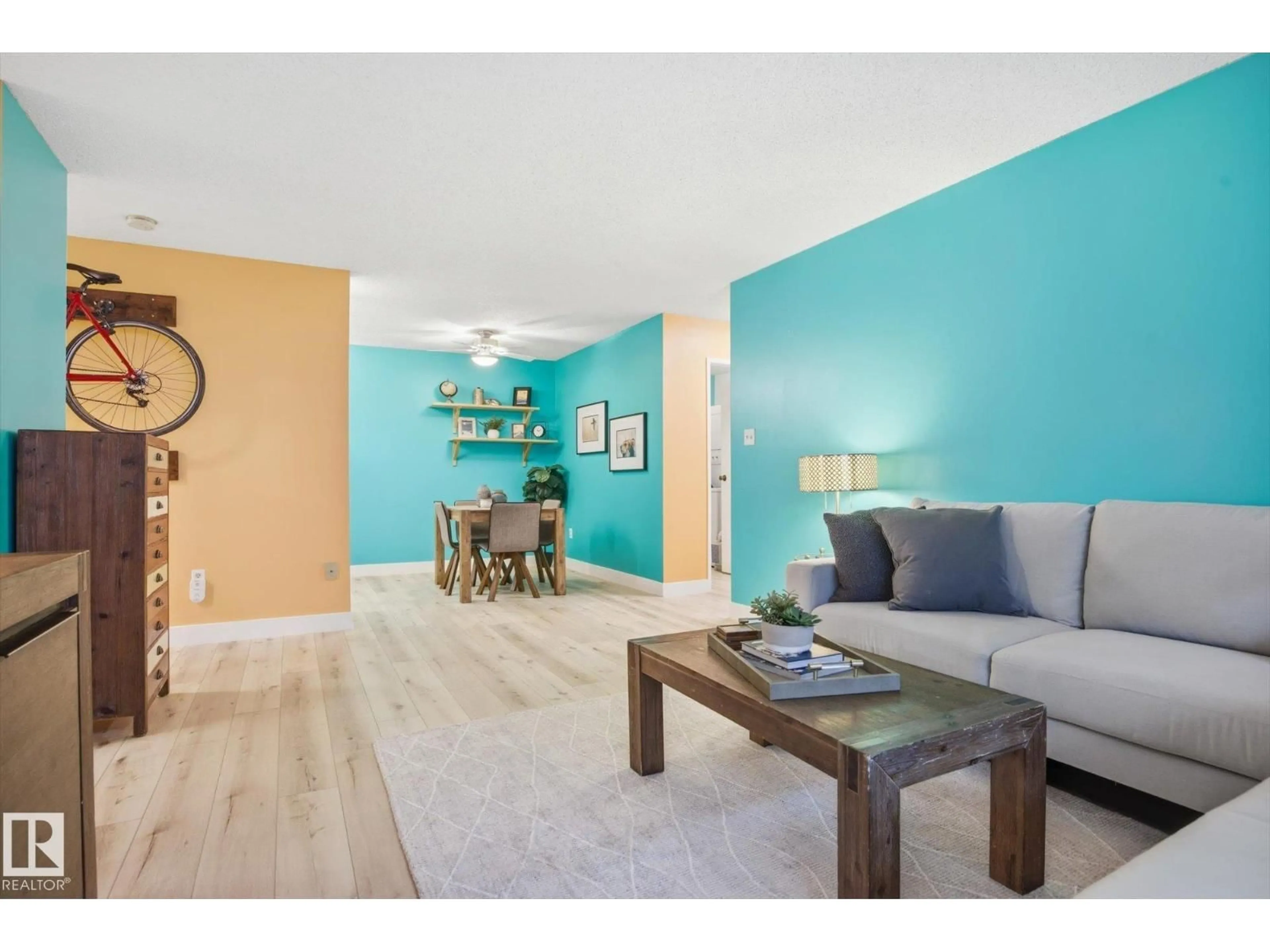 Living room with furniture, wood/laminate floor for #103 - 10732 86 AV, Edmonton Alberta T6E2M9