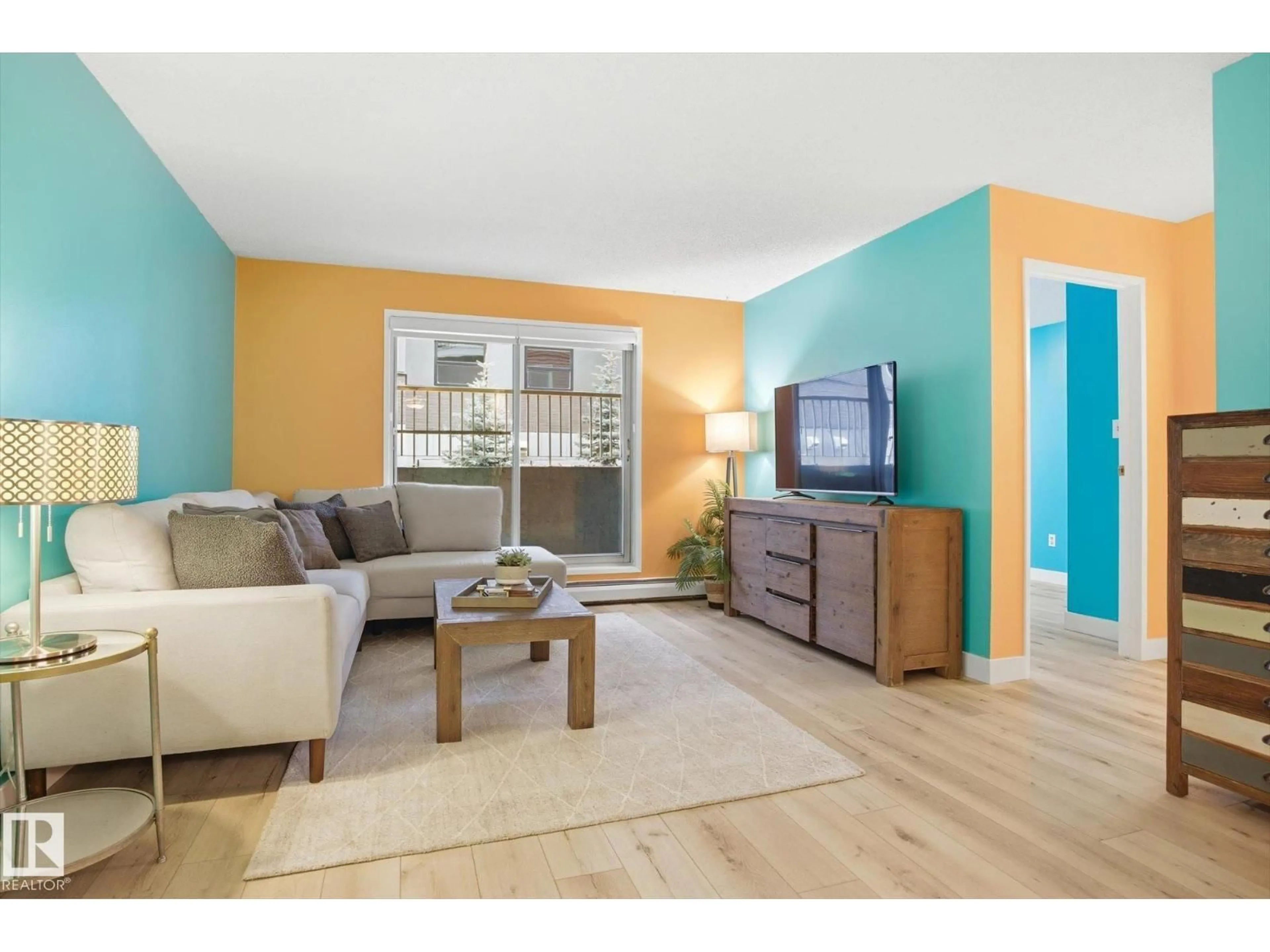 Living room with furniture, wood/laminate floor for #103 - 10732 86 AV, Edmonton Alberta T6E2M9