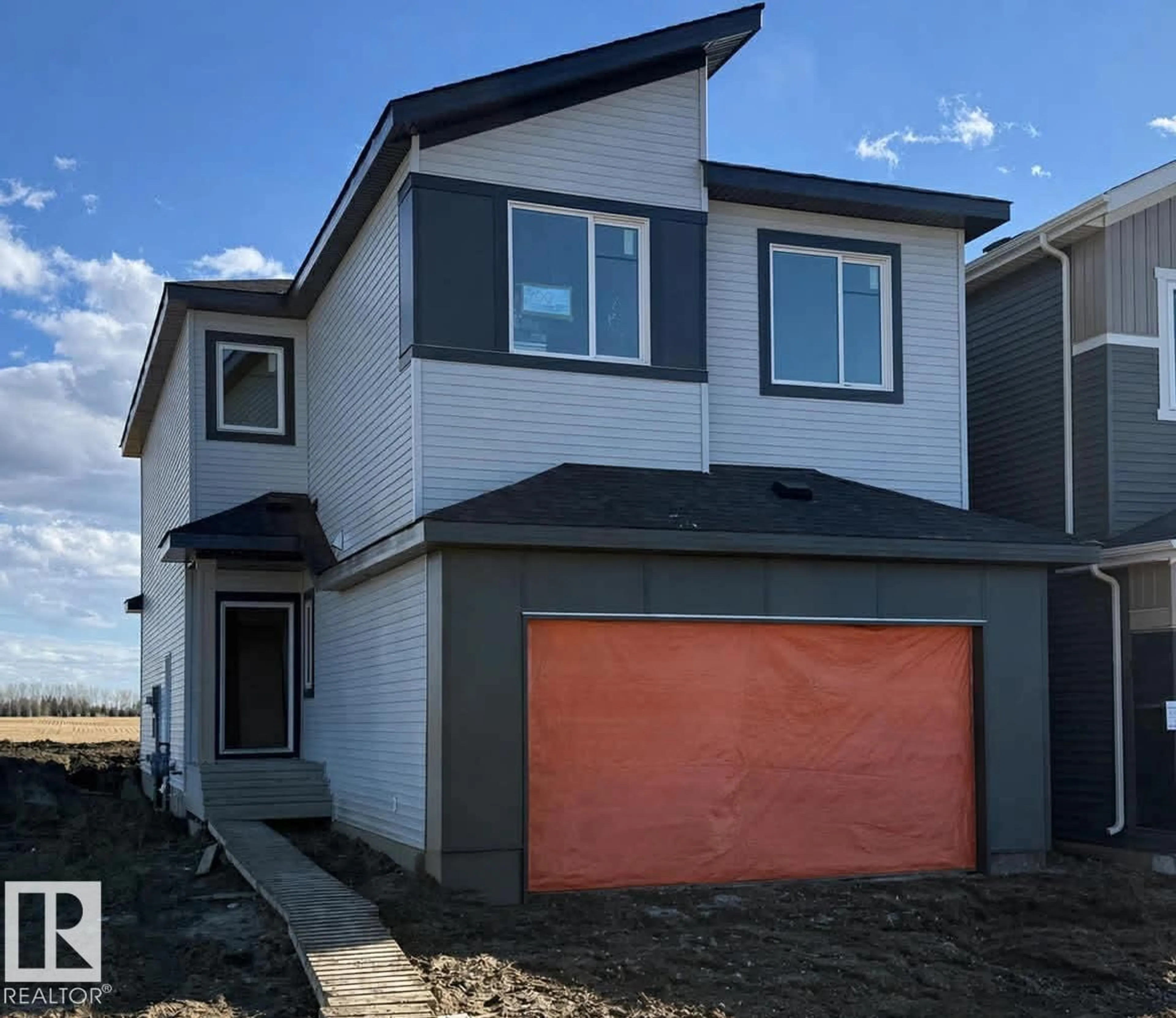 Home with vinyl exterior material, street for 700 BANK DR, Leduc Alberta T9E1W1