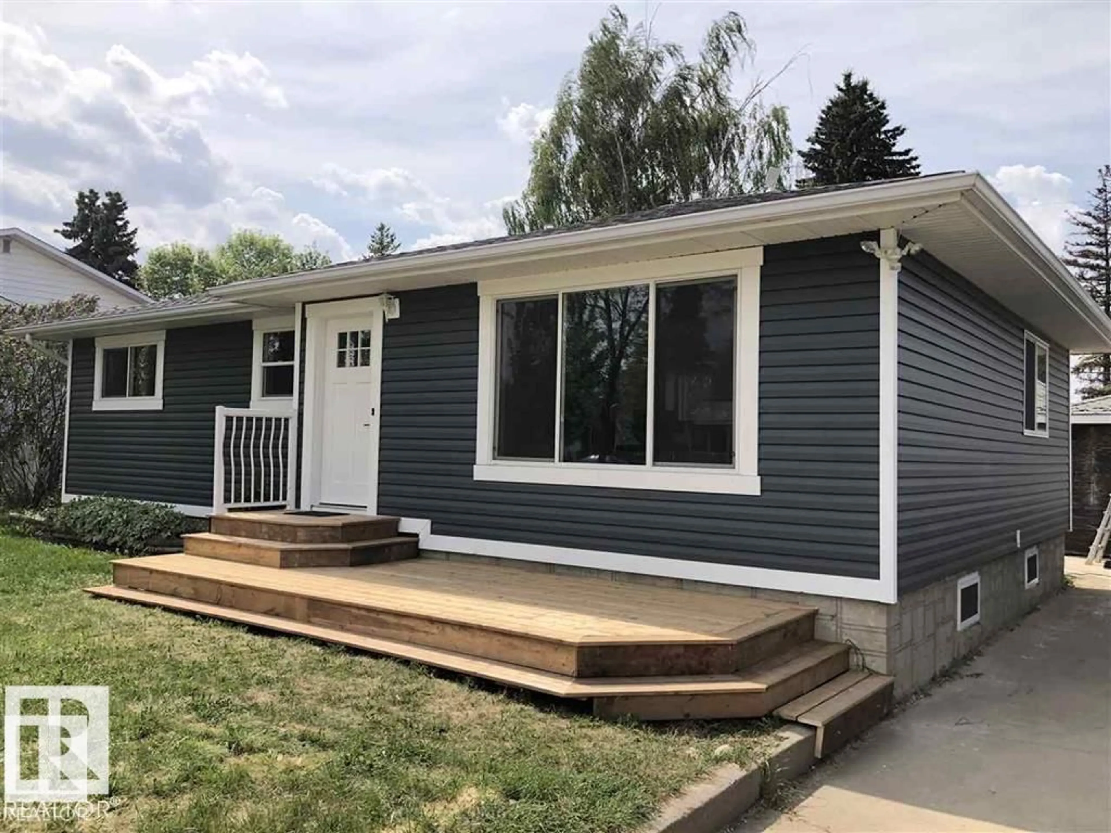 Home with vinyl exterior material, street for 9712 101 AV, Westlock Alberta T7P1Z4