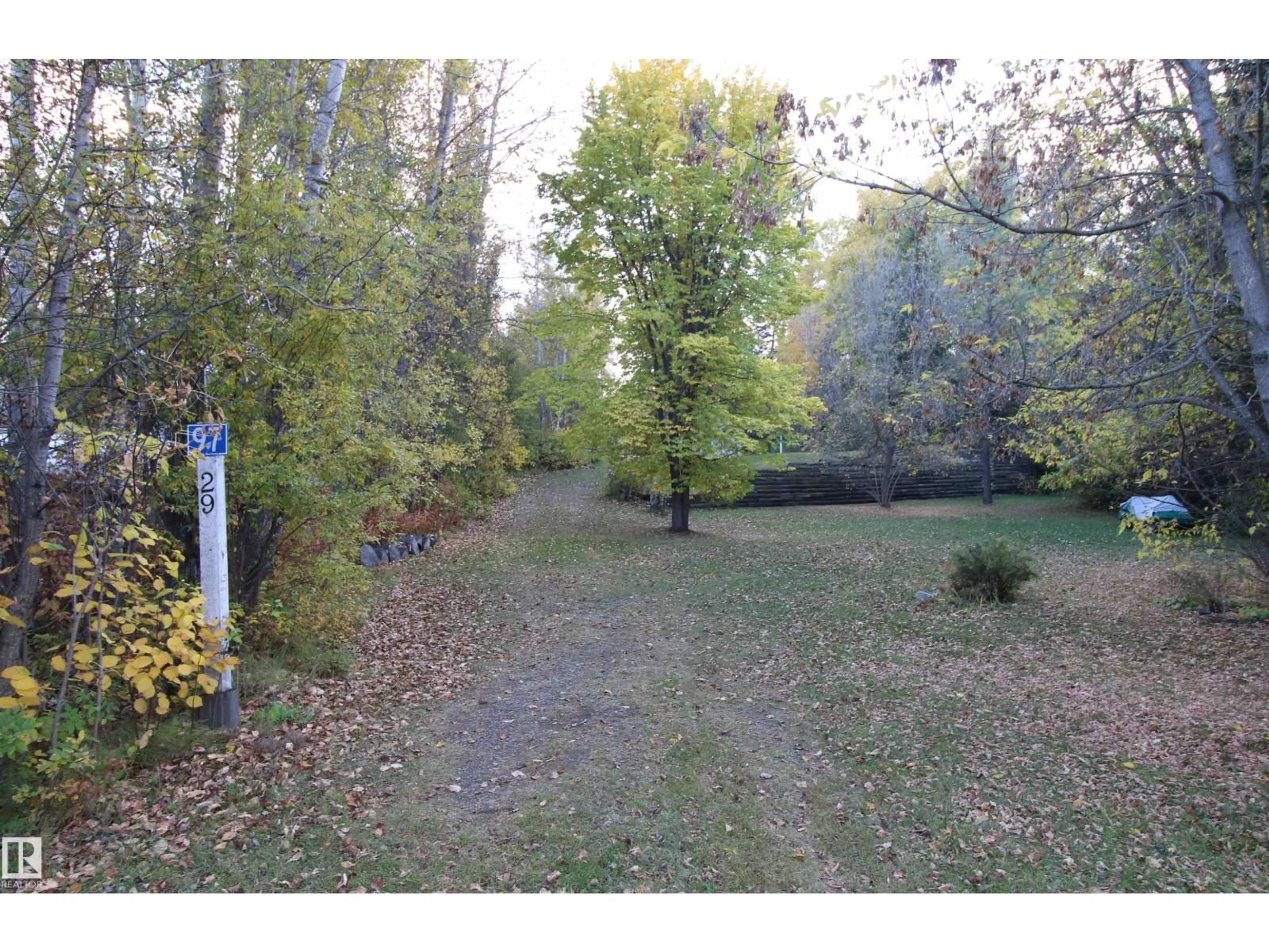A pic from outside/outdoor area/front of a property/back of a property/a pic from drone, forest/trees view for 97 - 4418 HWY 633, Rural Lac Ste. Anne County Alberta T0E0L0