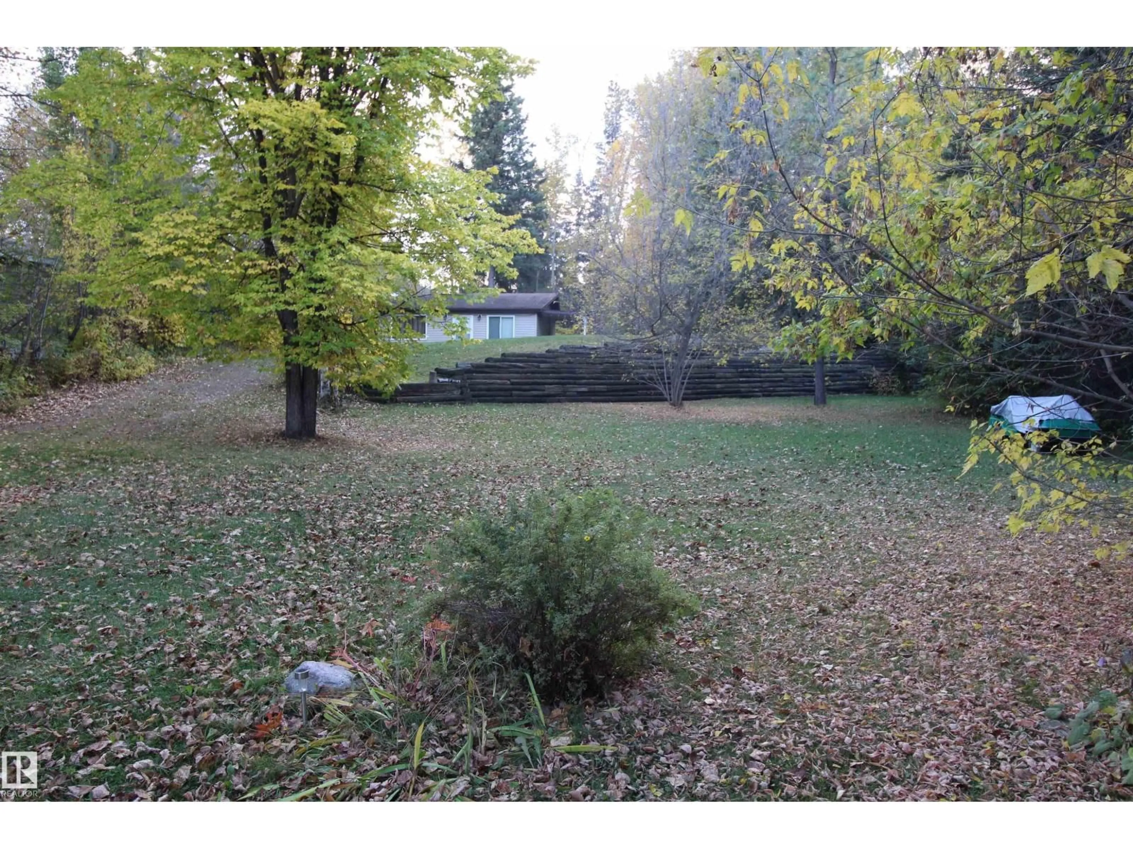 A pic from outside/outdoor area/front of a property/back of a property/a pic from drone, forest/trees view for 97 - 4418 HWY 633, Rural Lac Ste. Anne County Alberta T0E0L0