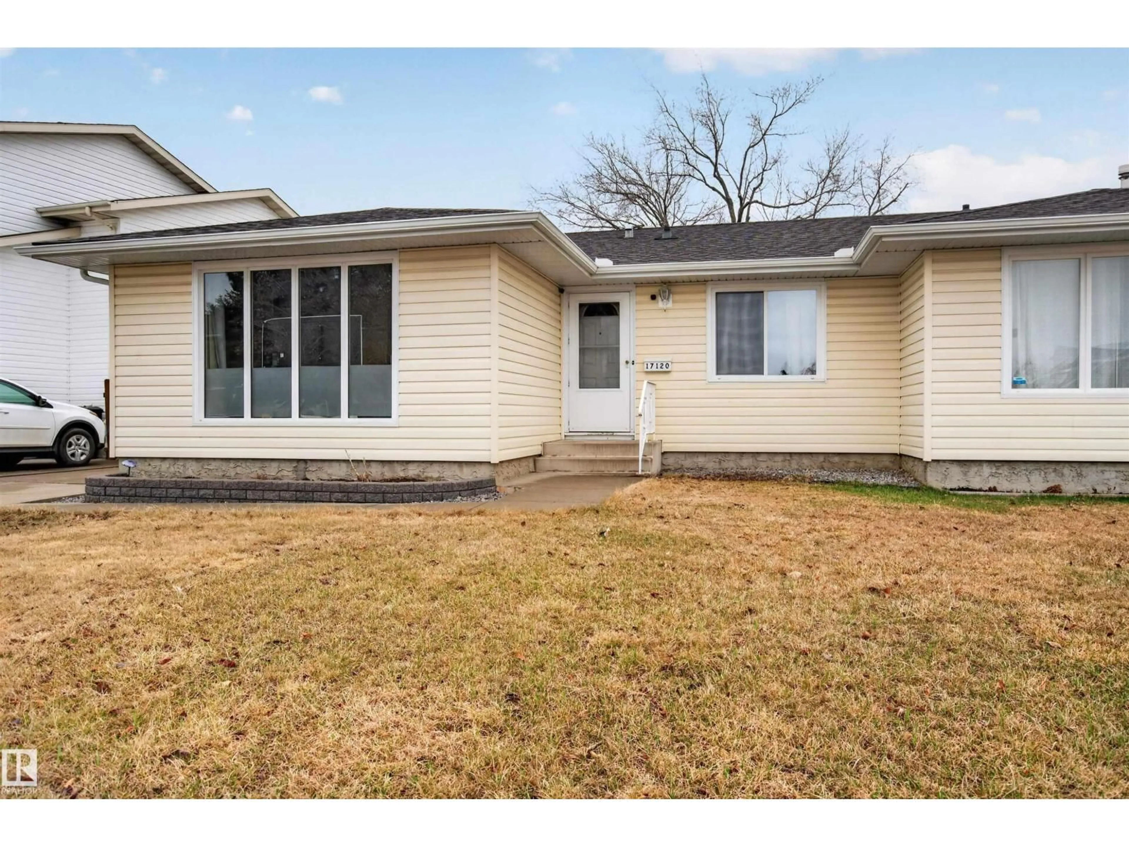 Home with vinyl exterior material, street for 17120 103 ST, Edmonton Alberta T5X4Z4