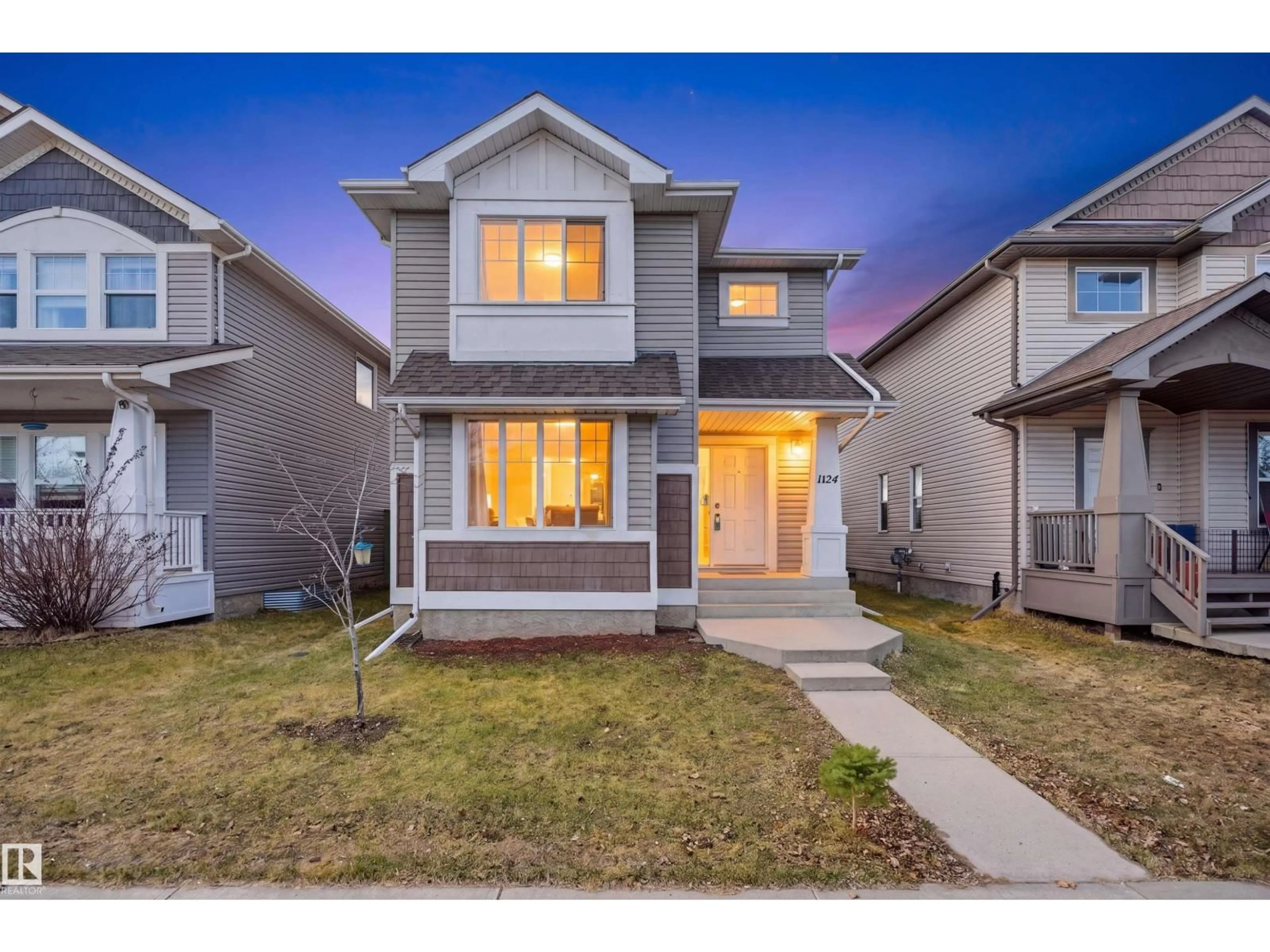 Home with vinyl exterior material, street for 1124 37A AV, Edmonton Alberta T6T0E7