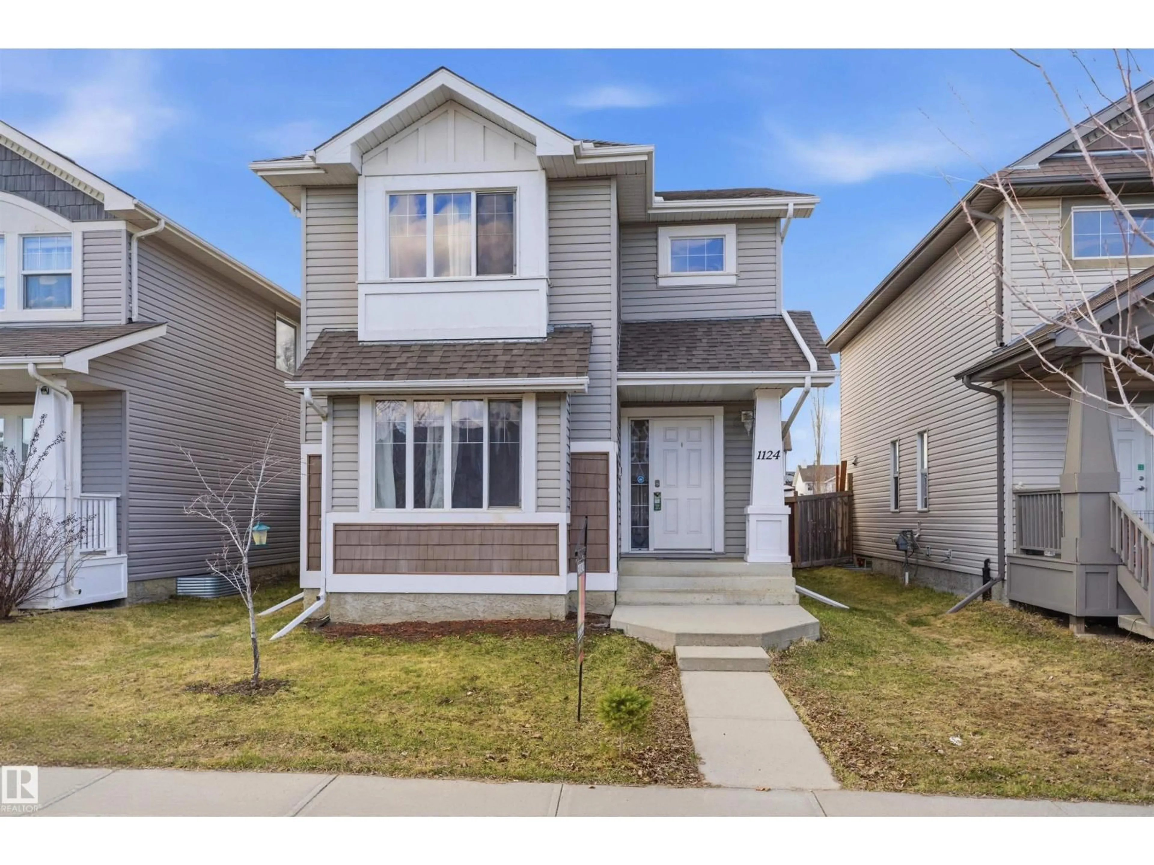 Home with vinyl exterior material, street for 1124 37A AV, Edmonton Alberta T6T0E7