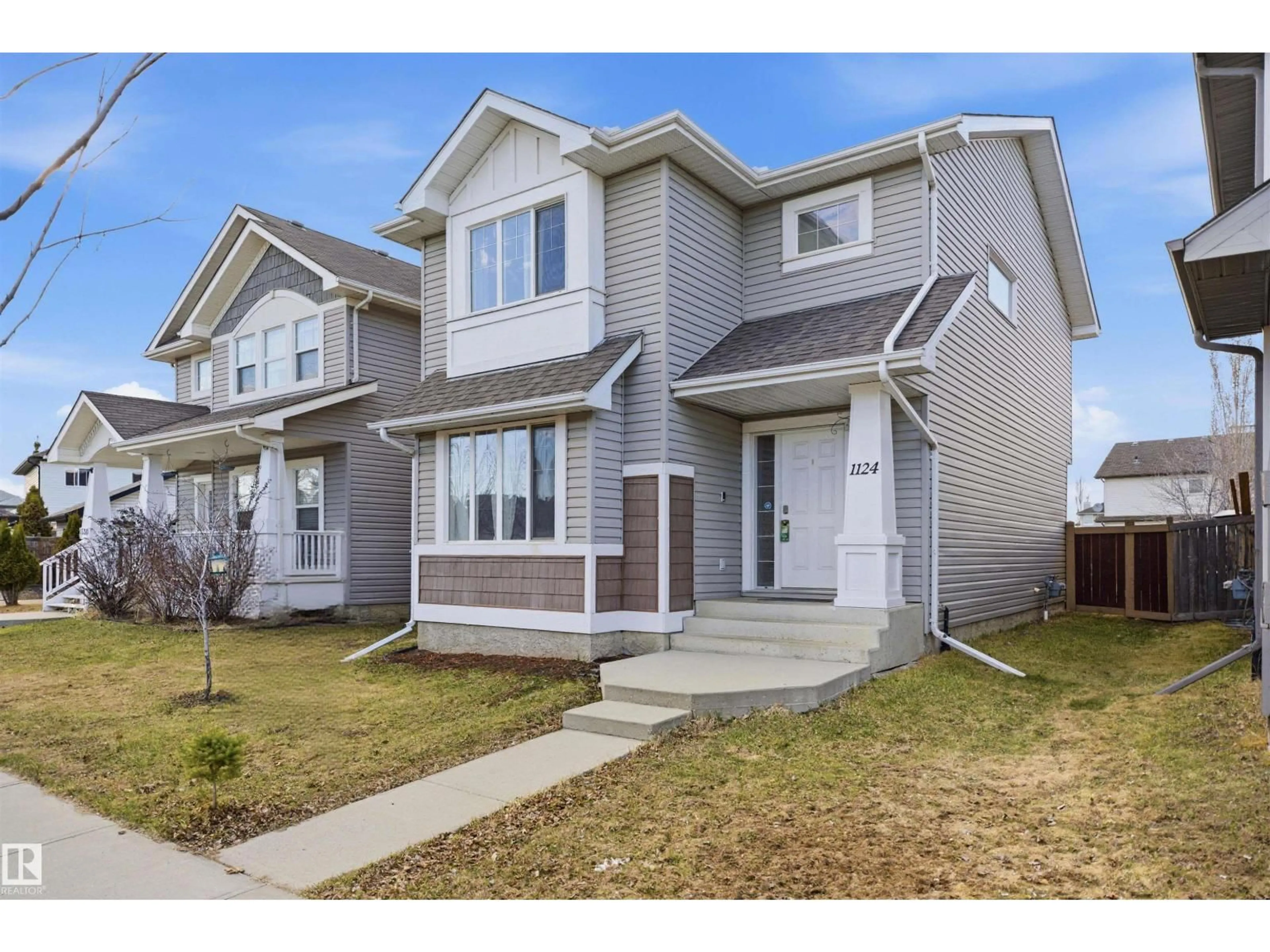 Home with vinyl exterior material, street for 1124 37A AV, Edmonton Alberta T6T0E7