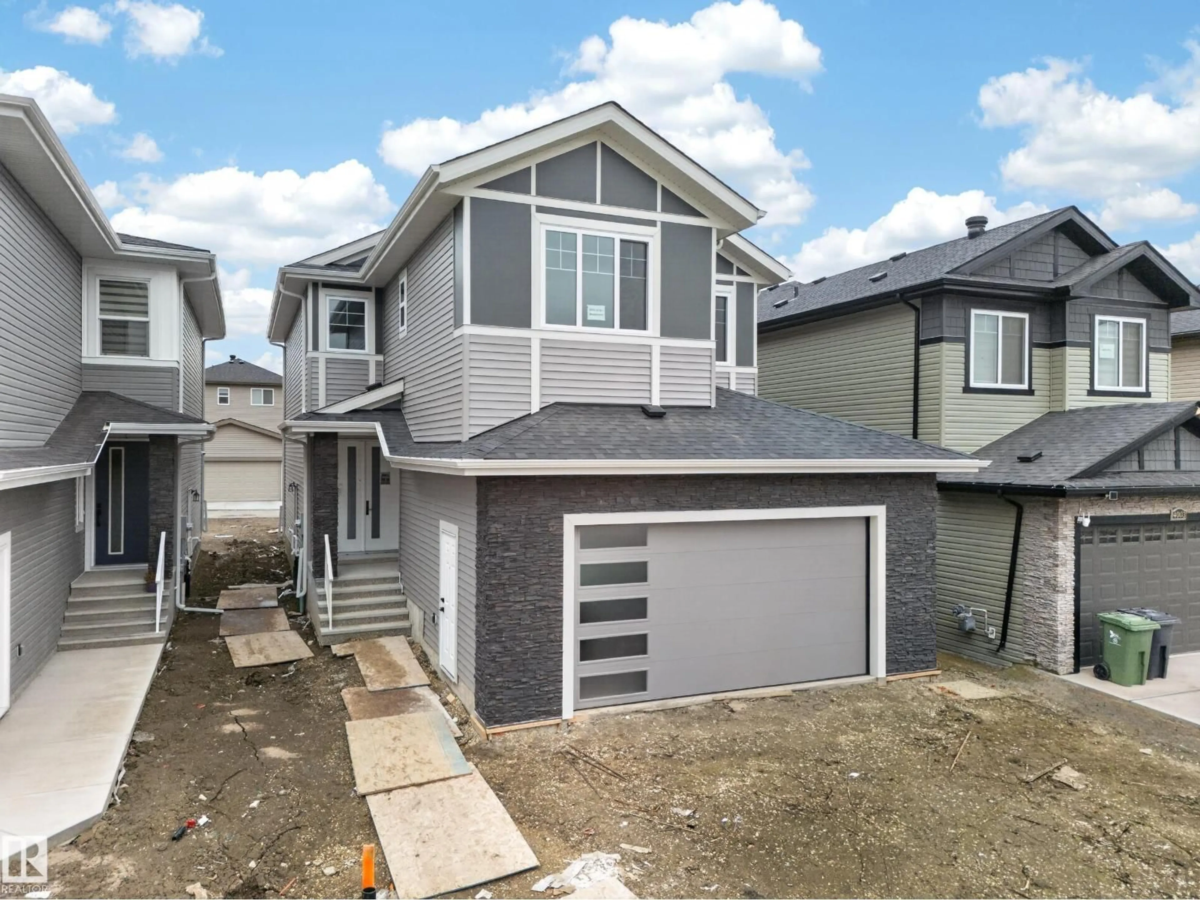 Home with vinyl exterior material, street for 4005 39 ST, Beaumont Alberta T6X3B5