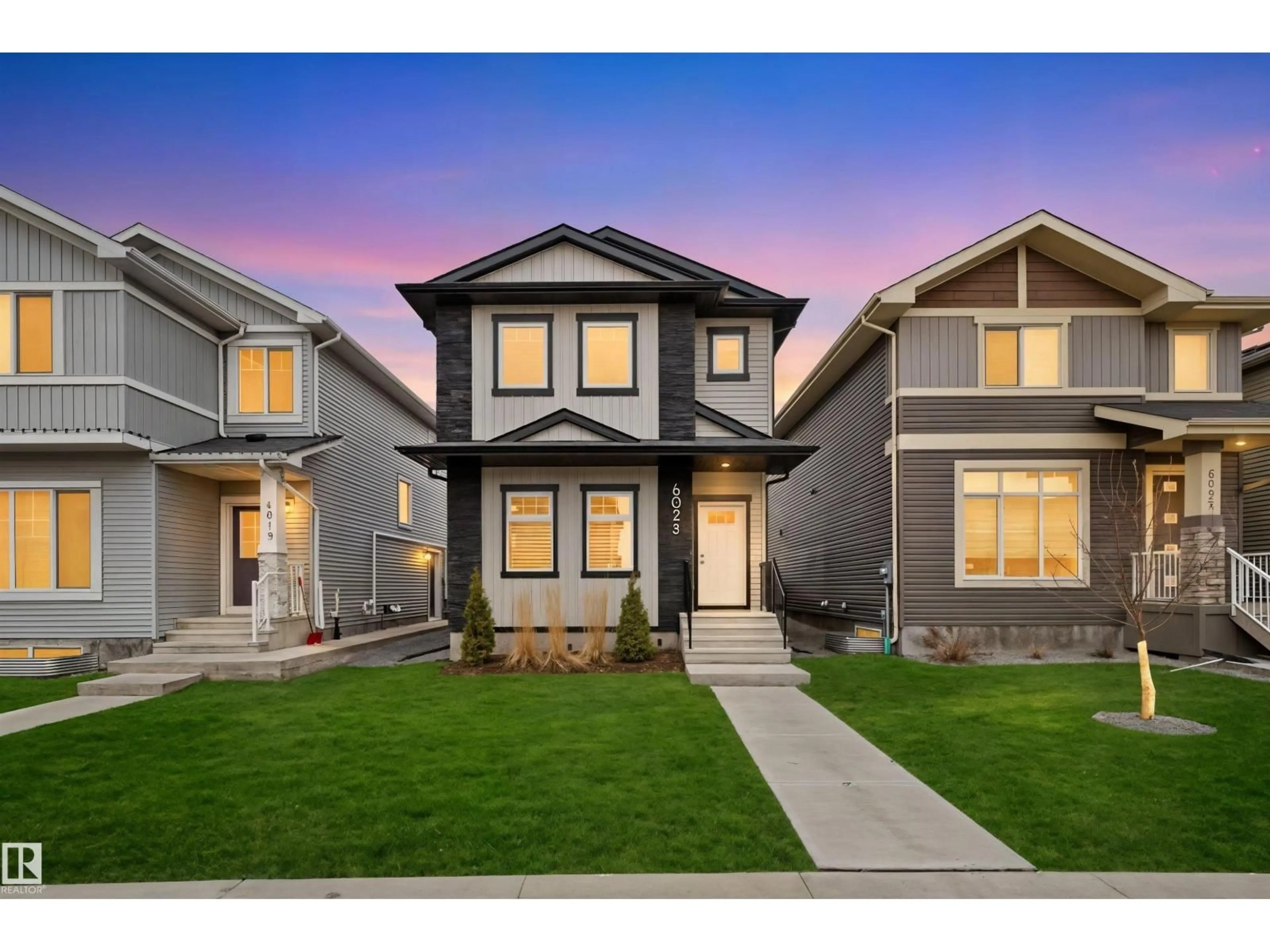 Home with vinyl exterior material, street for NW - 6023 180 AV, Edmonton Alberta T5Y3W9