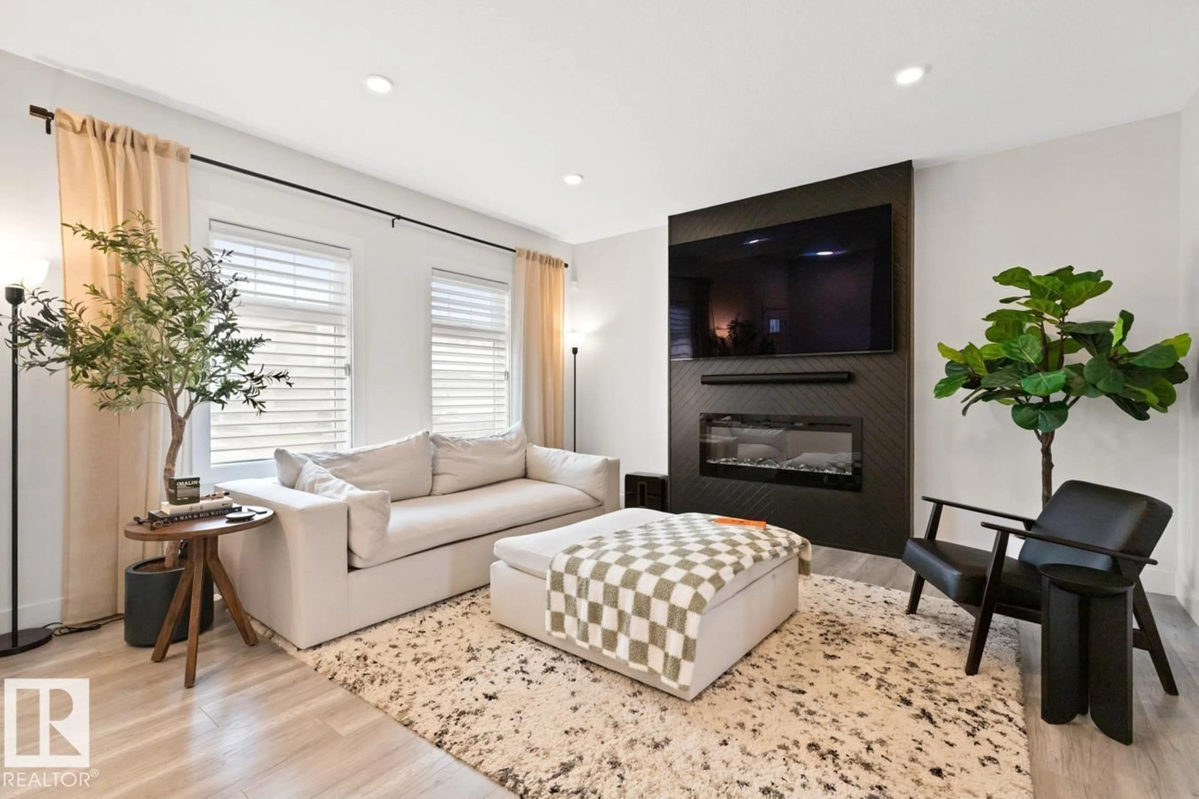 Living room with furniture, unknown for NW - 6023 180 AV, Edmonton Alberta T5Y3W9