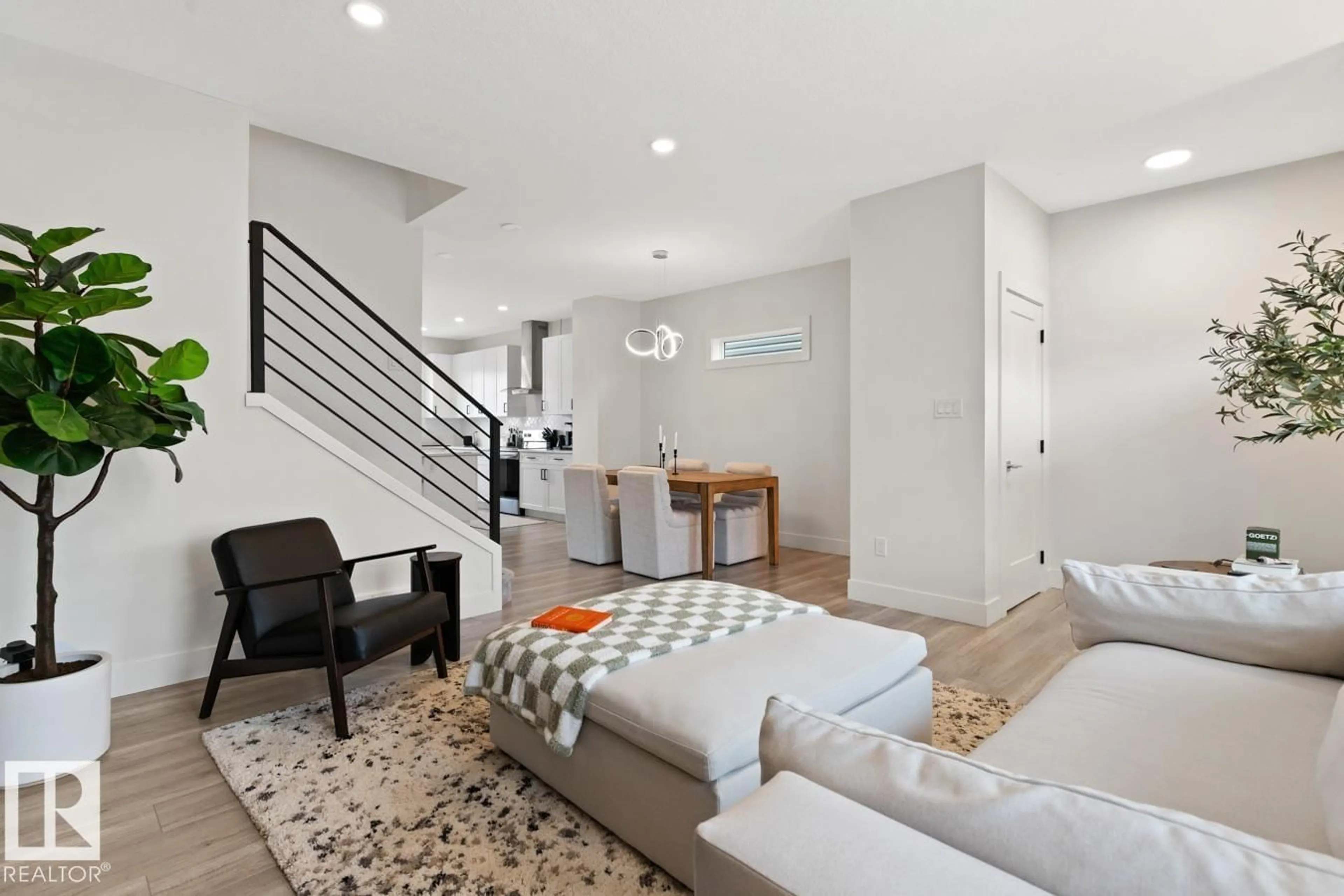 Living room with furniture, unknown for NW - 6023 180 AV, Edmonton Alberta T5Y3W9