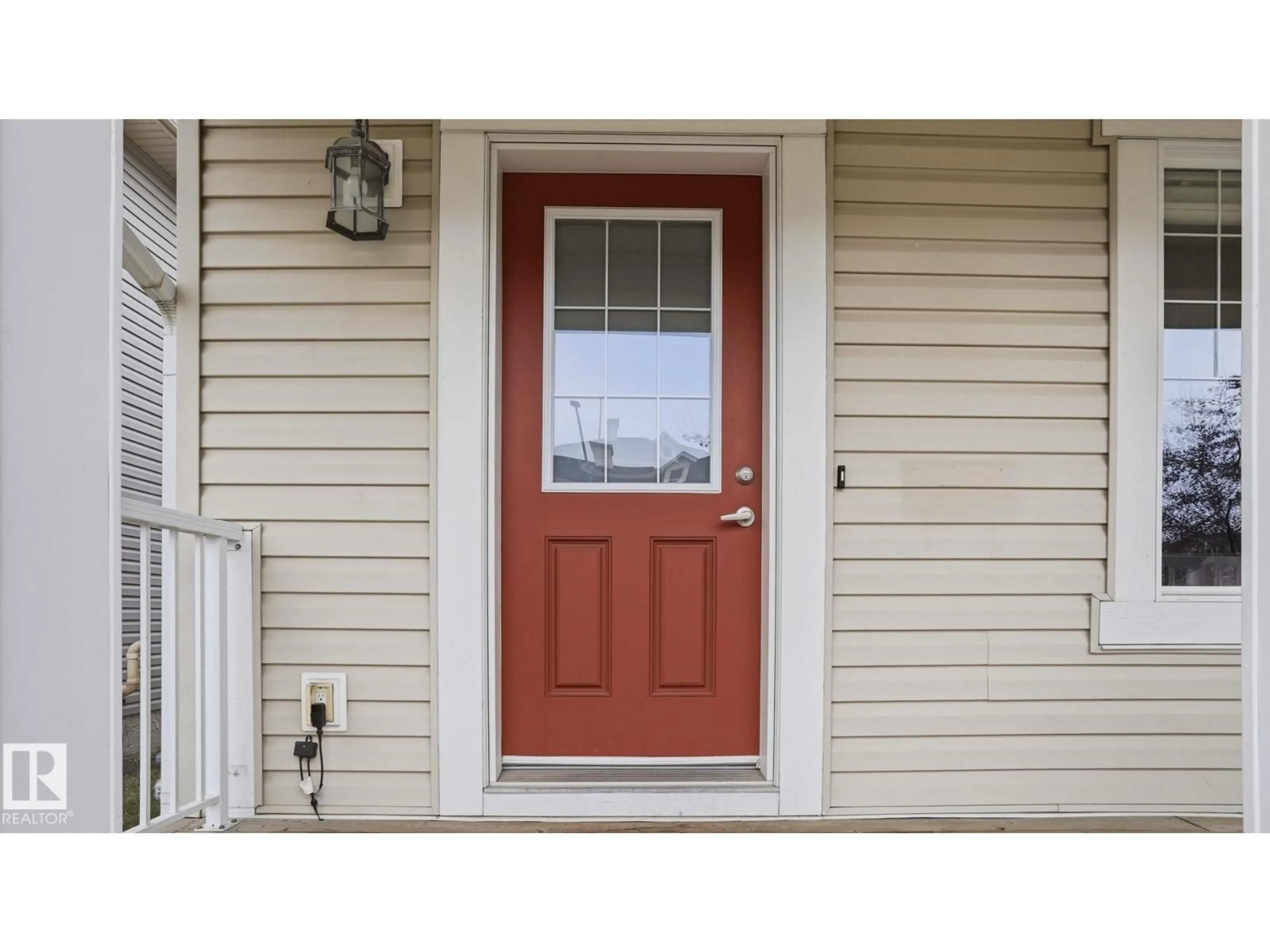 Home with vinyl exterior material, street for 8210 180 AV, Edmonton Alberta T5Z0H8