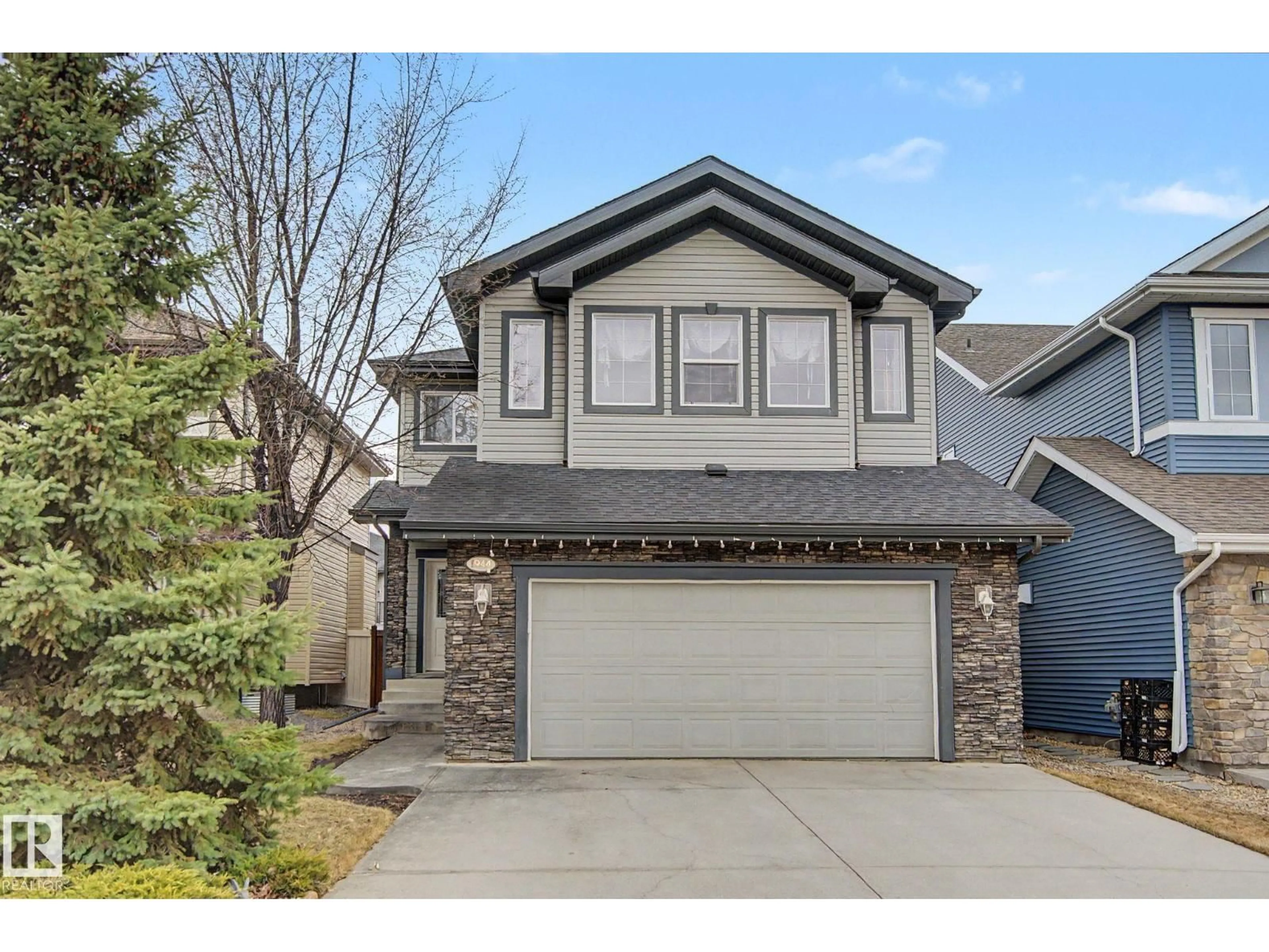 Home with vinyl exterior material, street for SW - 1944 67 ST, Edmonton Alberta T6X0L9