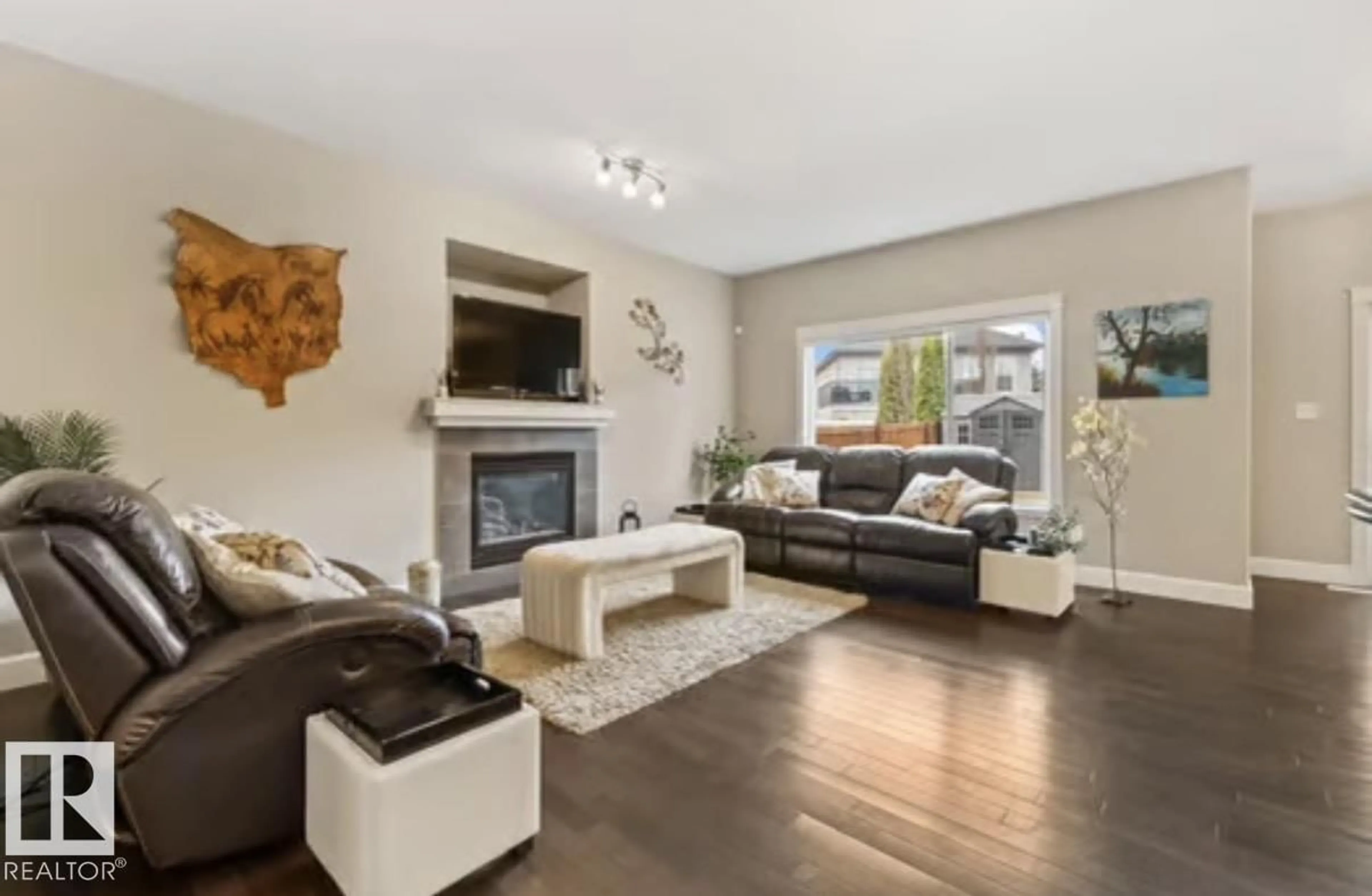 Living room with furniture, wood/laminate floor for SW - 1944 67 ST, Edmonton Alberta T6X0L9