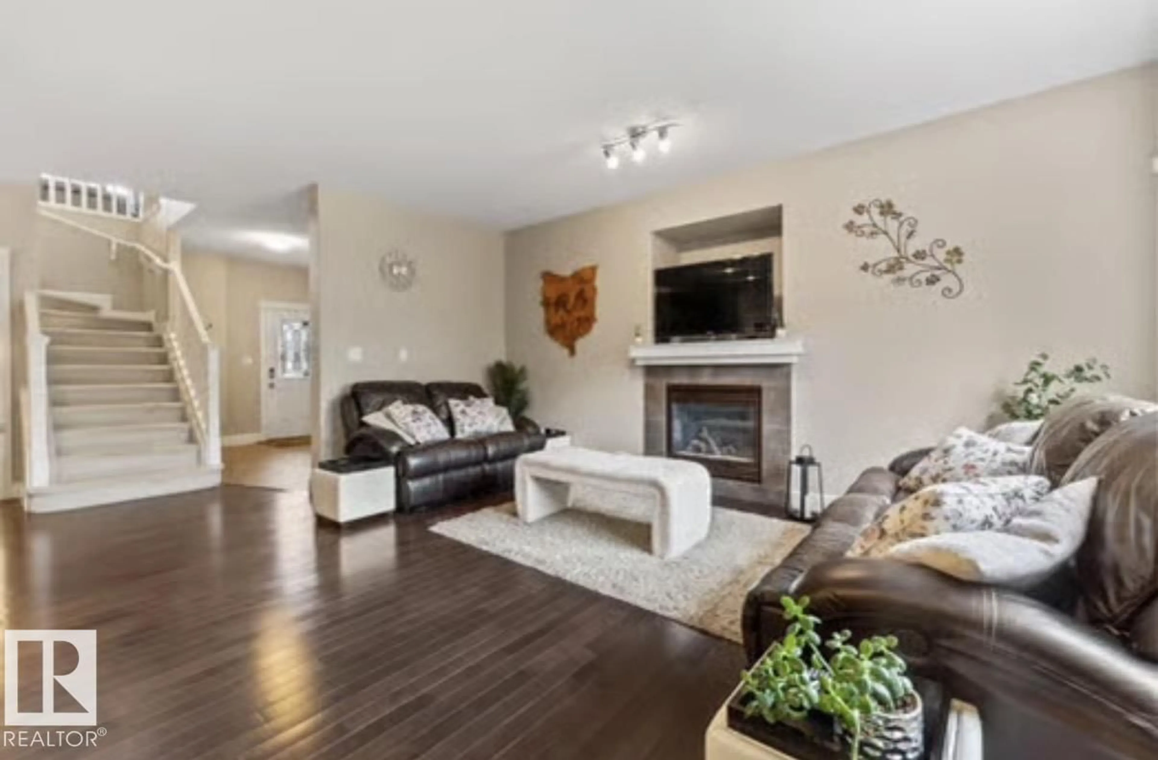 Living room with furniture, wood/laminate floor for SW - 1944 67 ST, Edmonton Alberta T6X0L9