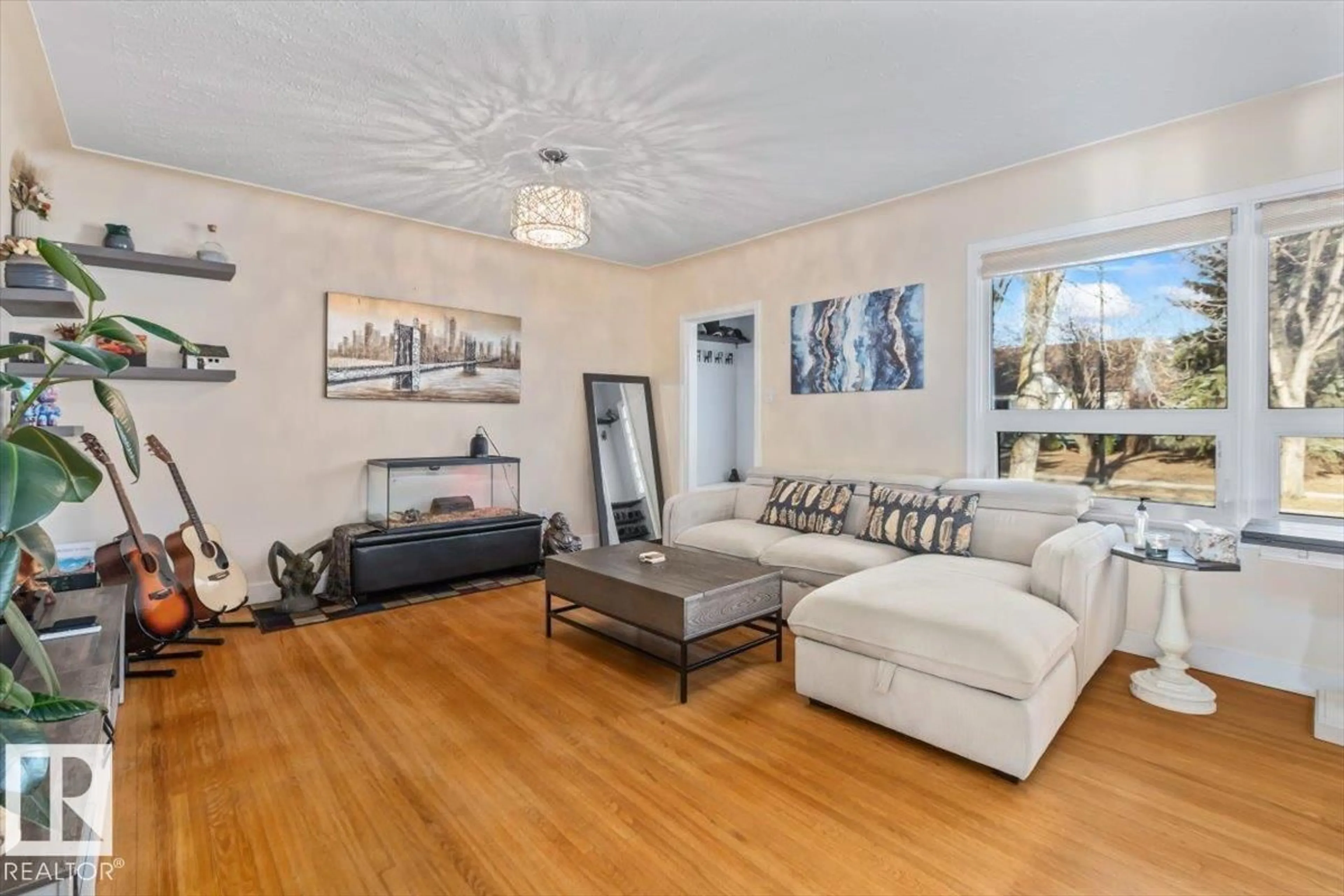 Living room with furniture, wood/laminate floor for NW - 10756 133 ST, Edmonton Alberta T5M1G6