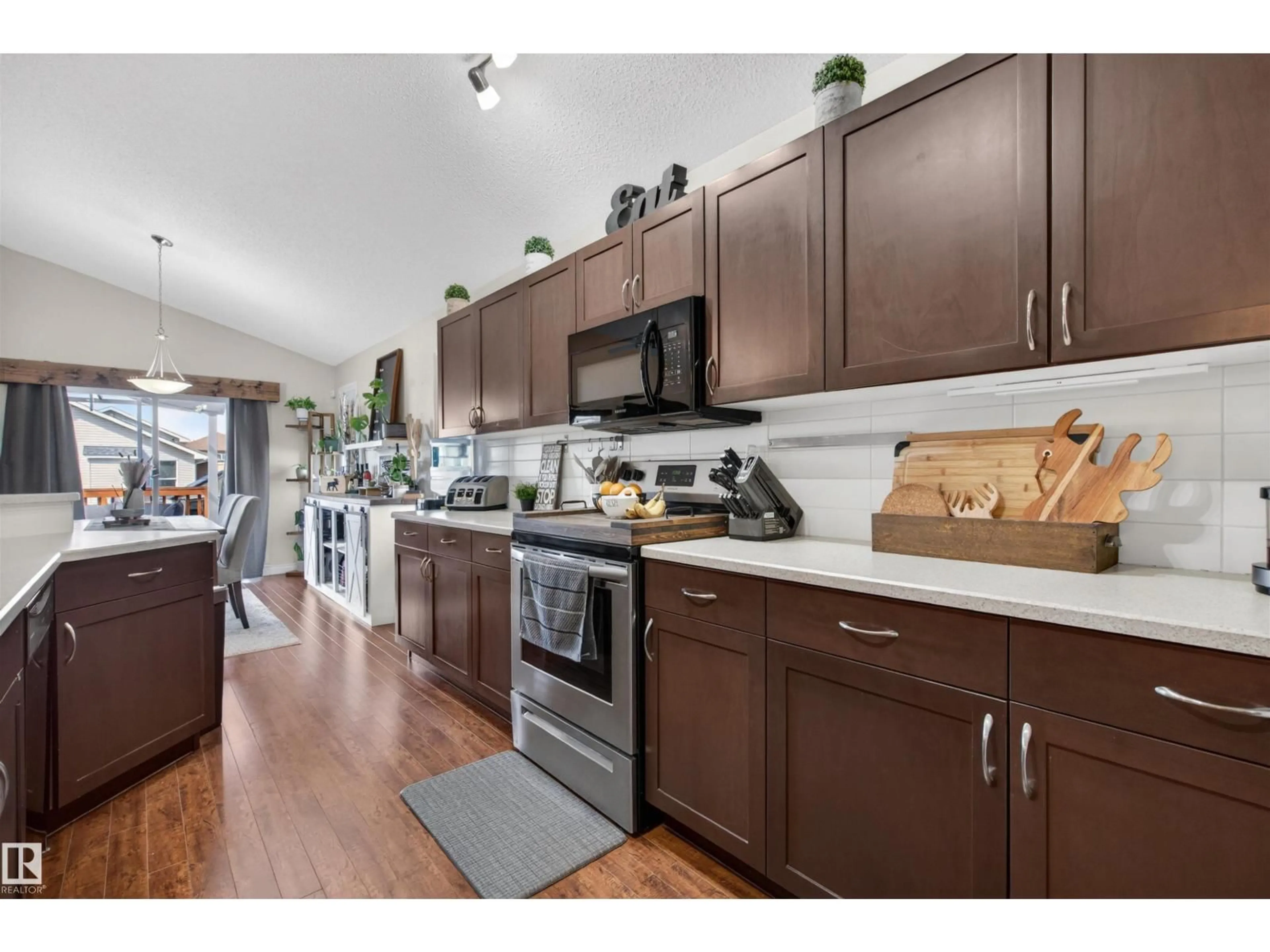 Open concept kitchen, wood/laminate floor for NW - 16528 132 ST, Edmonton Alberta T6V0J4