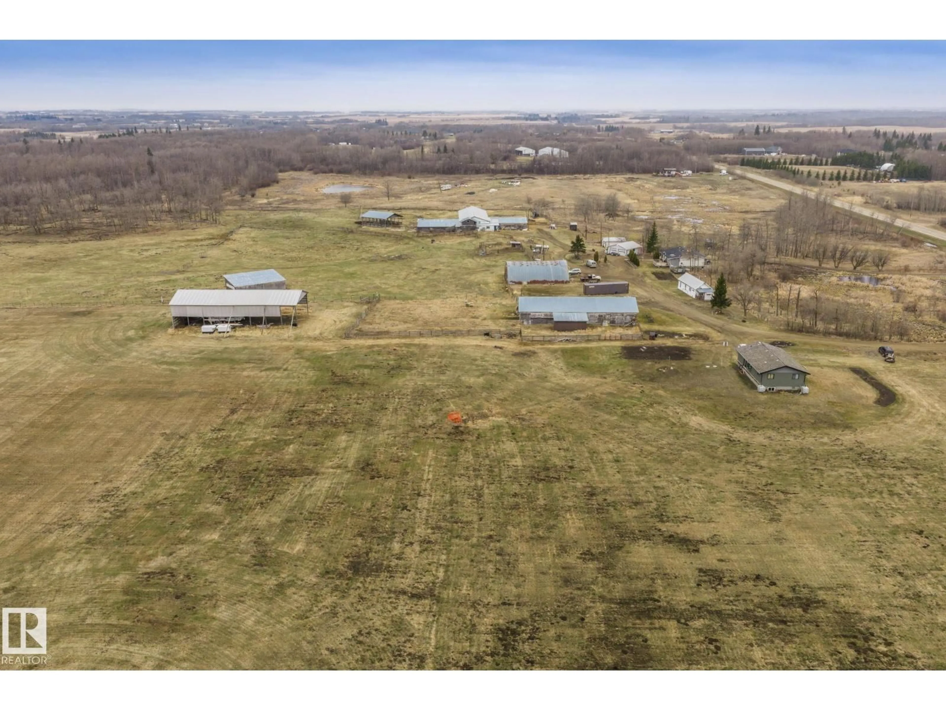A pic from outside/outdoor area/front of a property/back of a property/a pic from drone, building for 23127 TWP RD 502, Rural Leduc County Alberta T4X0R2